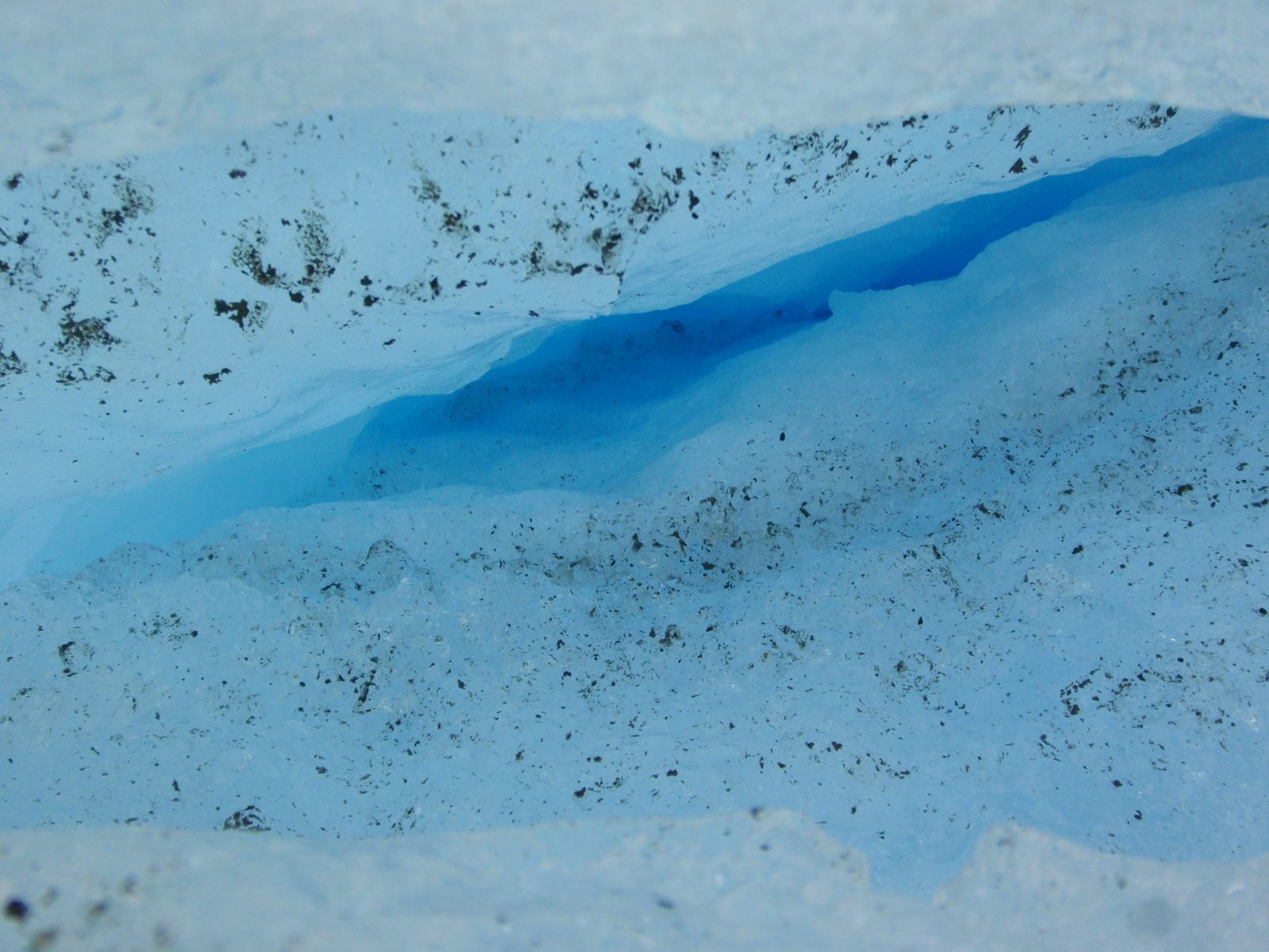 Looking into a deep, deep crevasse.  I guess if you fell in one, you would at least have a very...