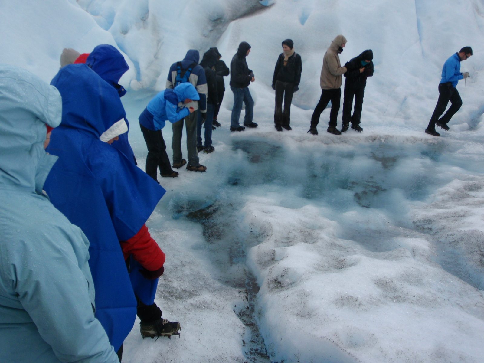 Melty puddles of icy slush on top of the glacier.