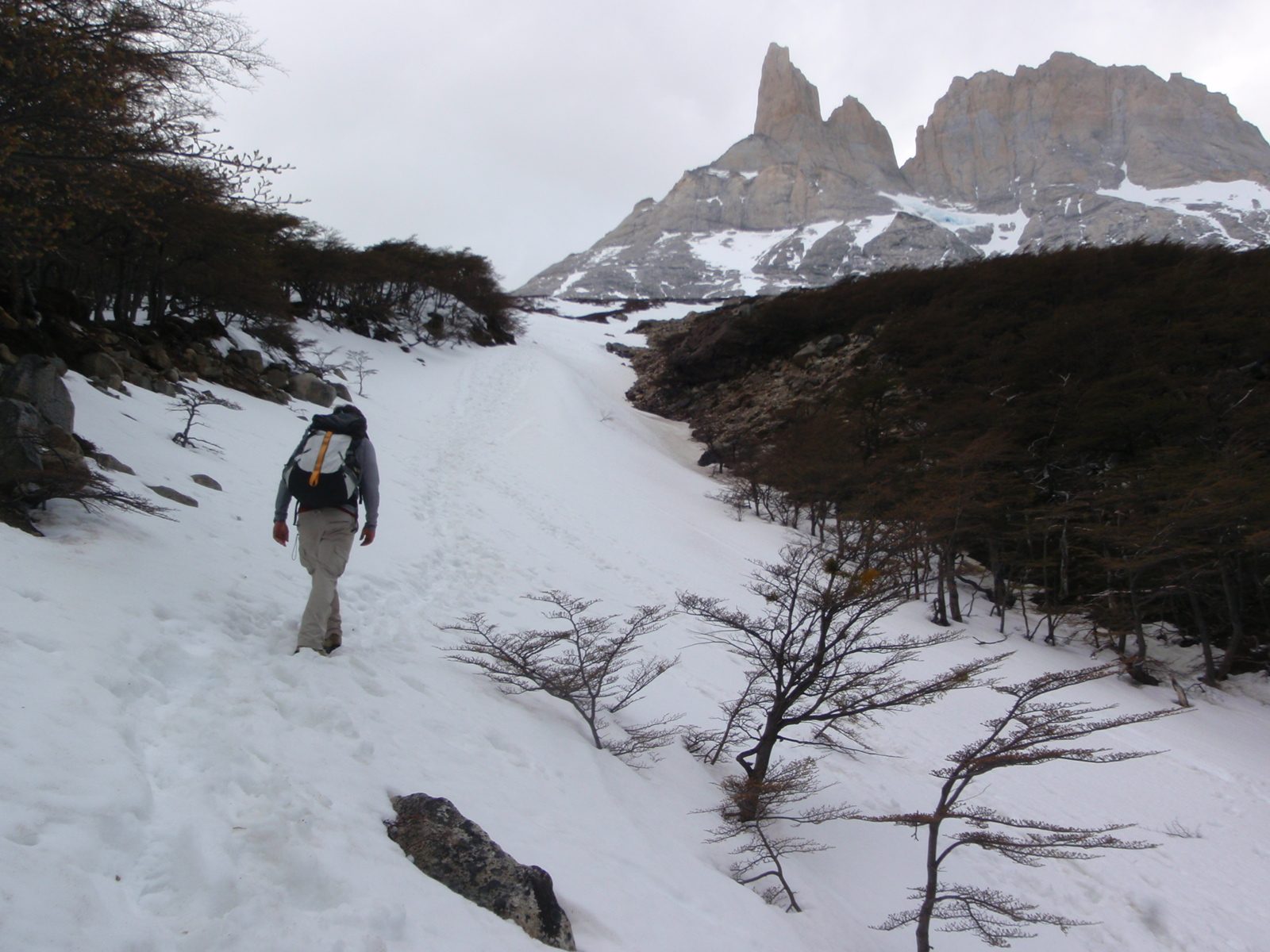 Eventually our trail was completely covered by snow, giving us the option of postholing in...