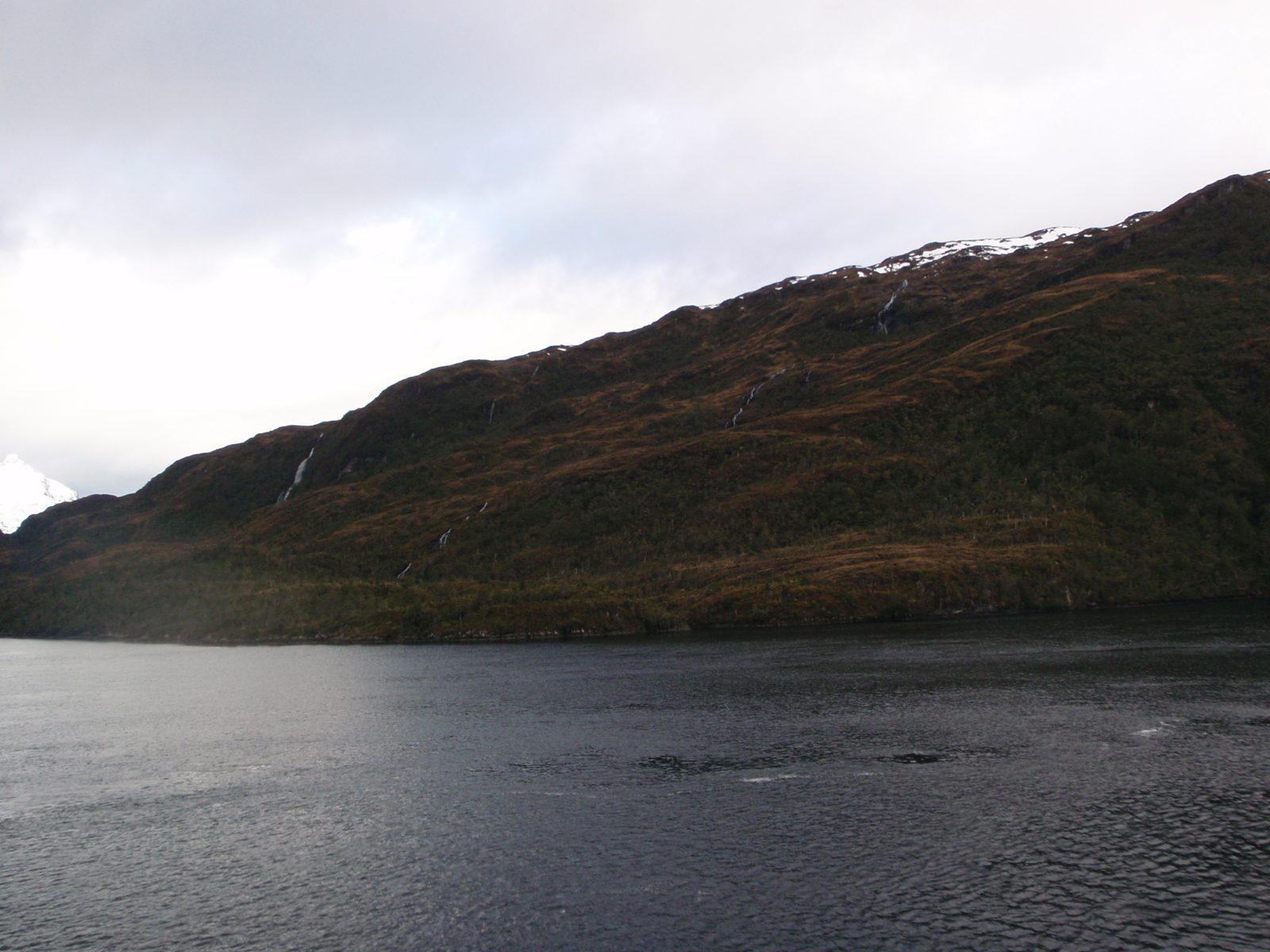 Here you can see small waterfalls cascading down into the fjords from glacial ice fields and...