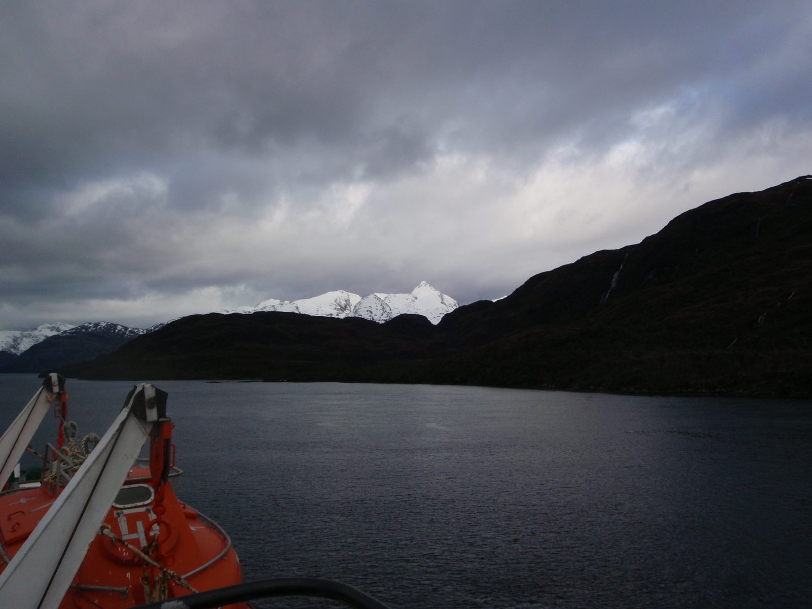 Snow-covered peaks looming in the distance. I was talking with one of the crew members who...