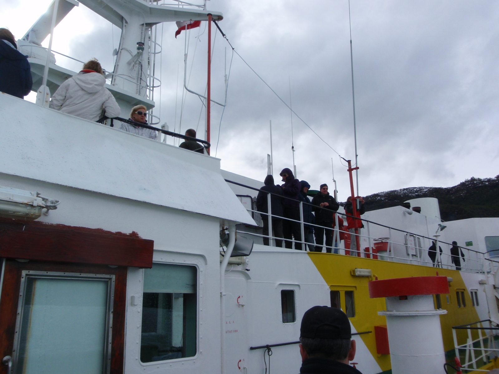 People watching the glacier from the top deck.