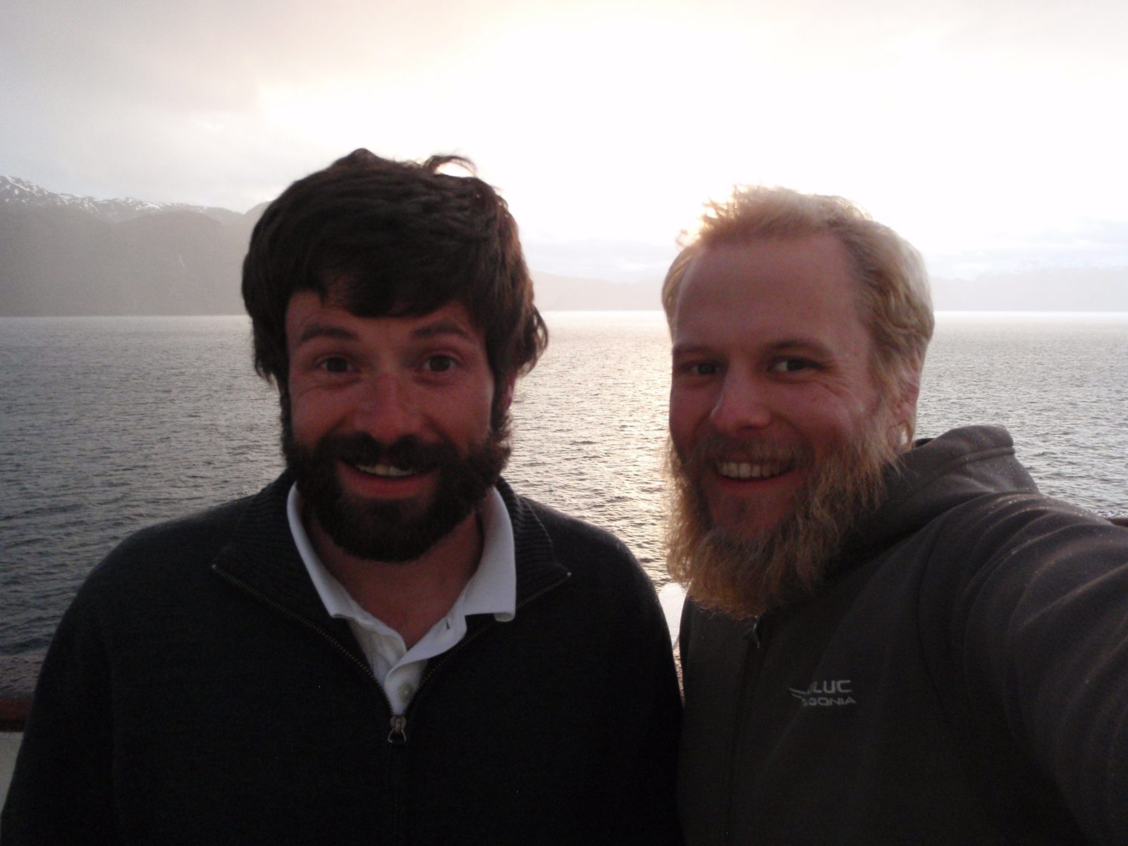 Two bearded mountain men on a boat.