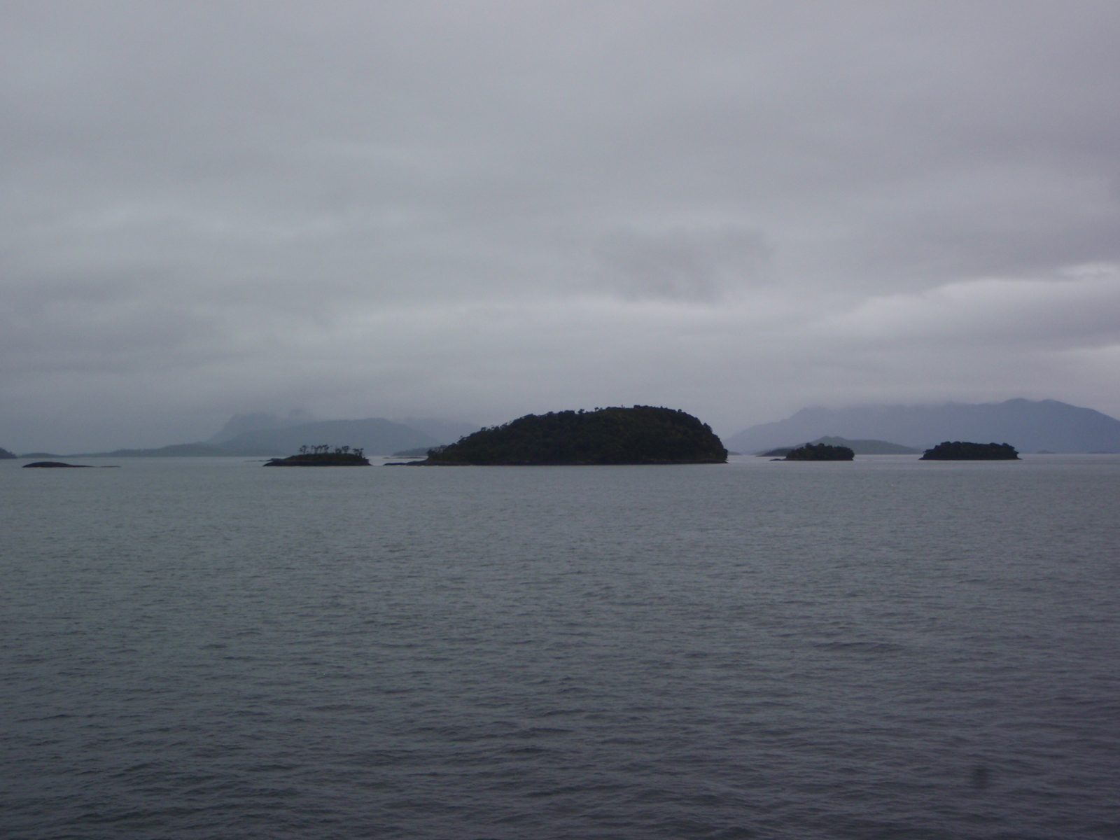 Weird looking islands, that sort of look like a pod of whales swimming along.