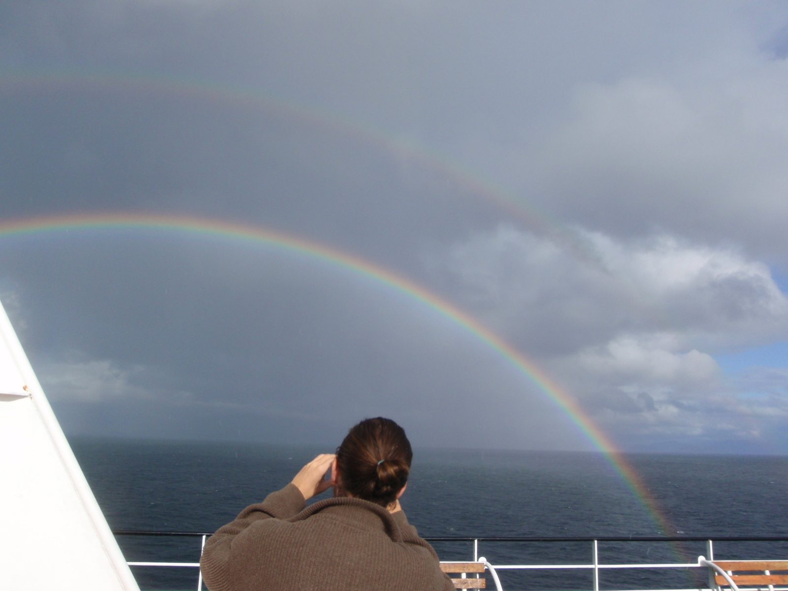 Our friend and bunkmate Pascal photographing the rainbow.