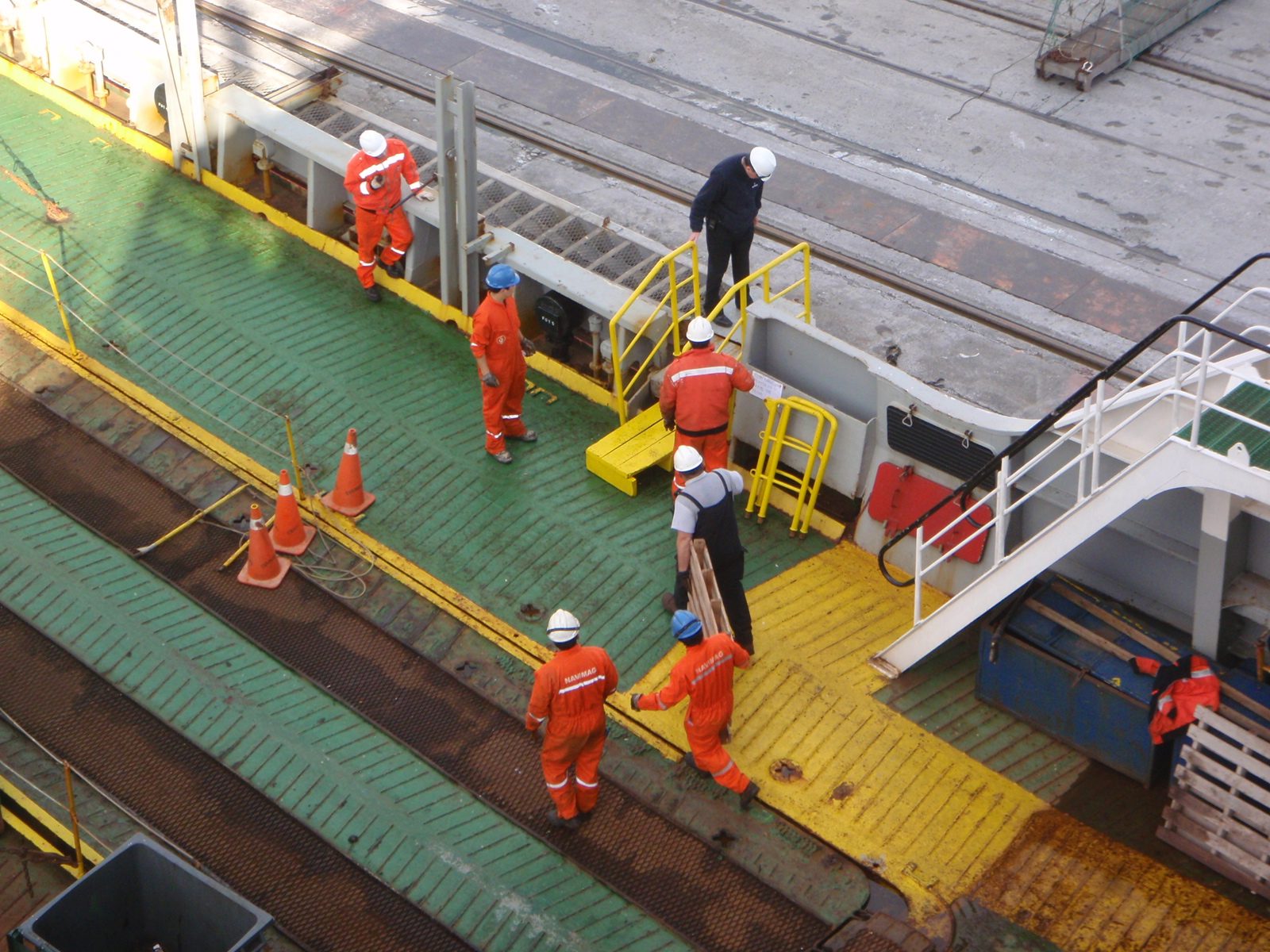 Putting down the gangplank so we can disembark. These guys had really cool suits!