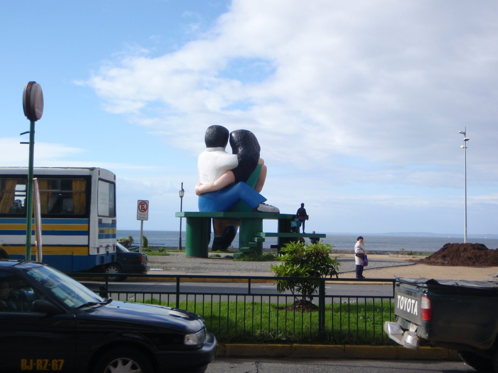 Lovers staring at the sea.