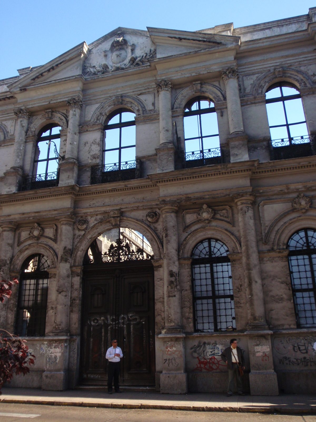 Facade of a 19th century looking building, held in place by steel supports. I wonder if it's...