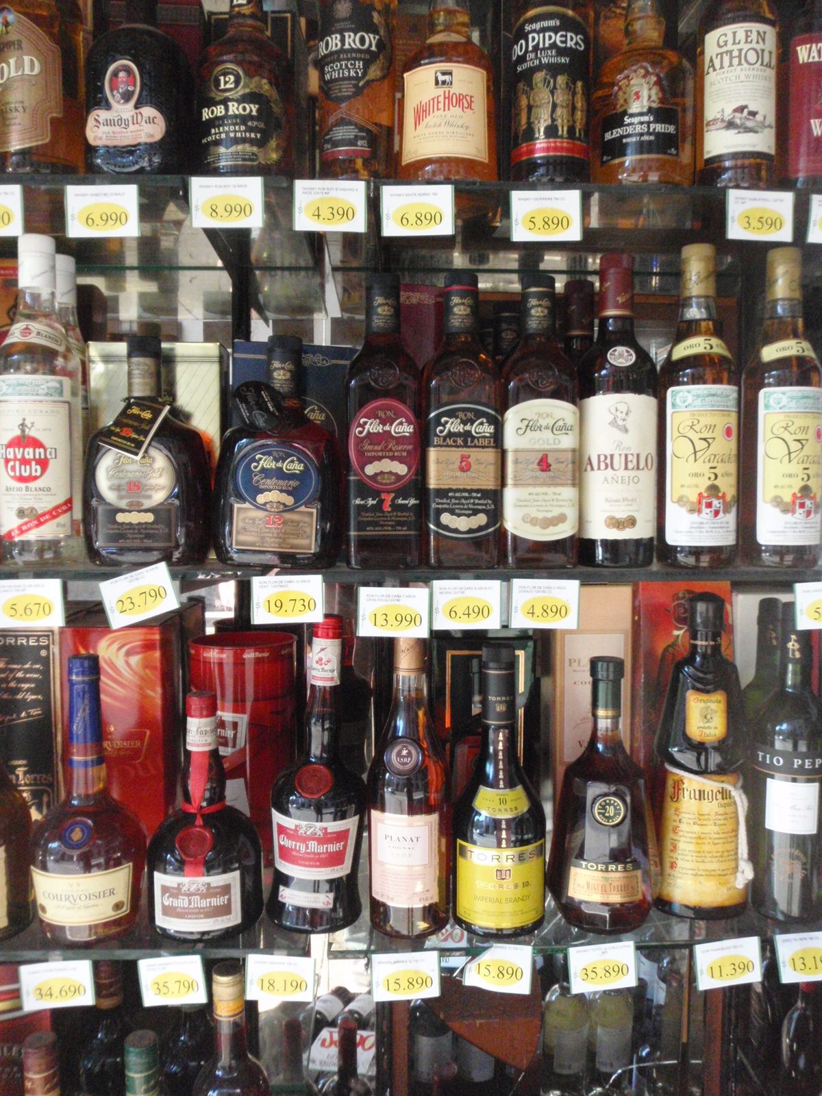 View through the window of a liquor store. Do they have Cherry Marnier in the United States?...