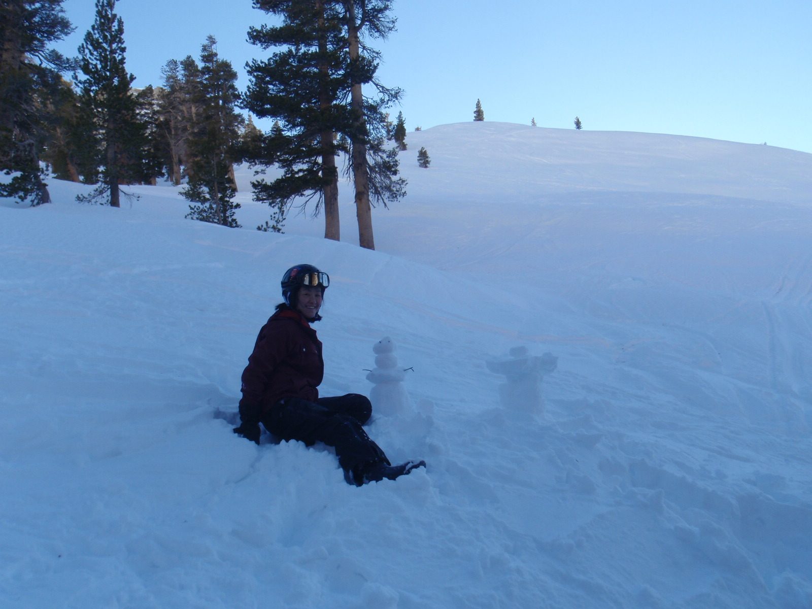 Monica built a small snowman.