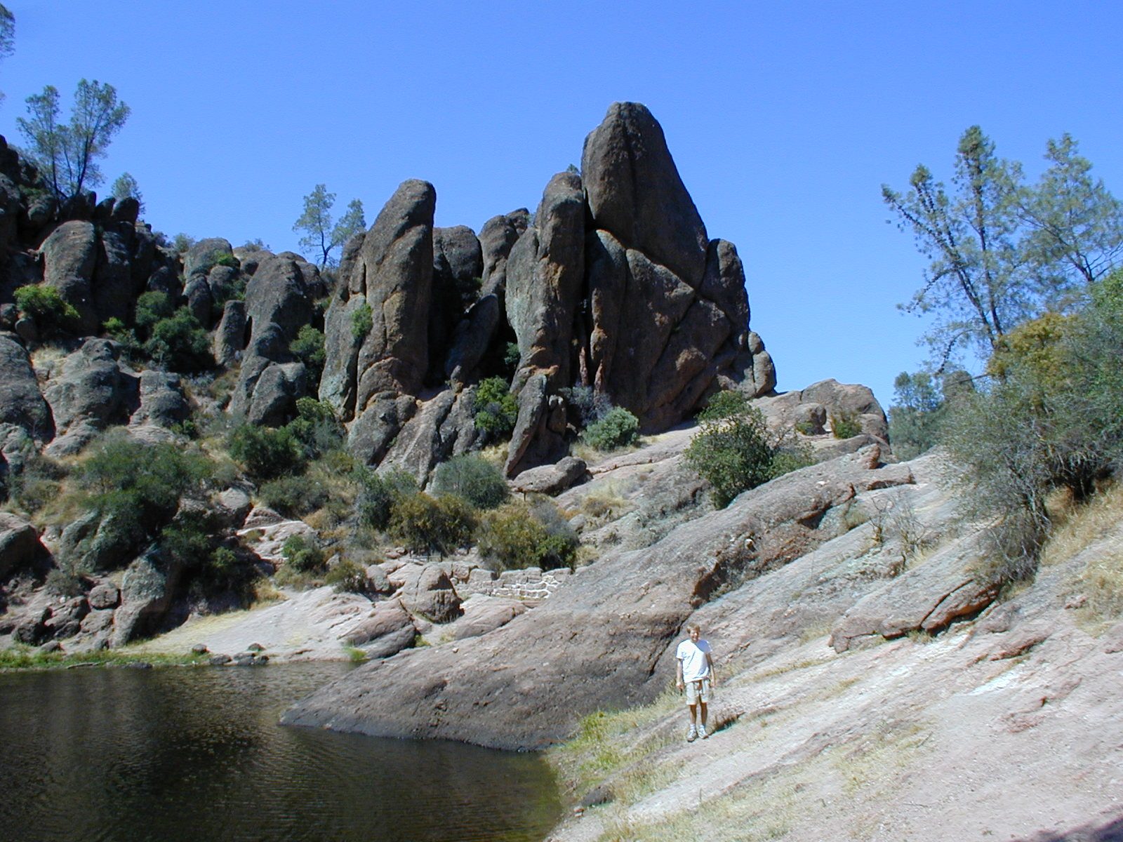 John next to a dammed up pond.