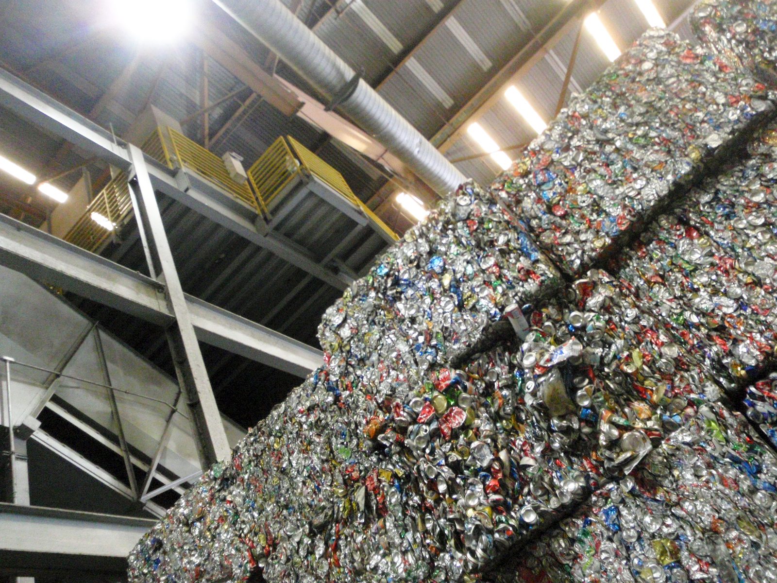 Stacked as high as the forklift will go.