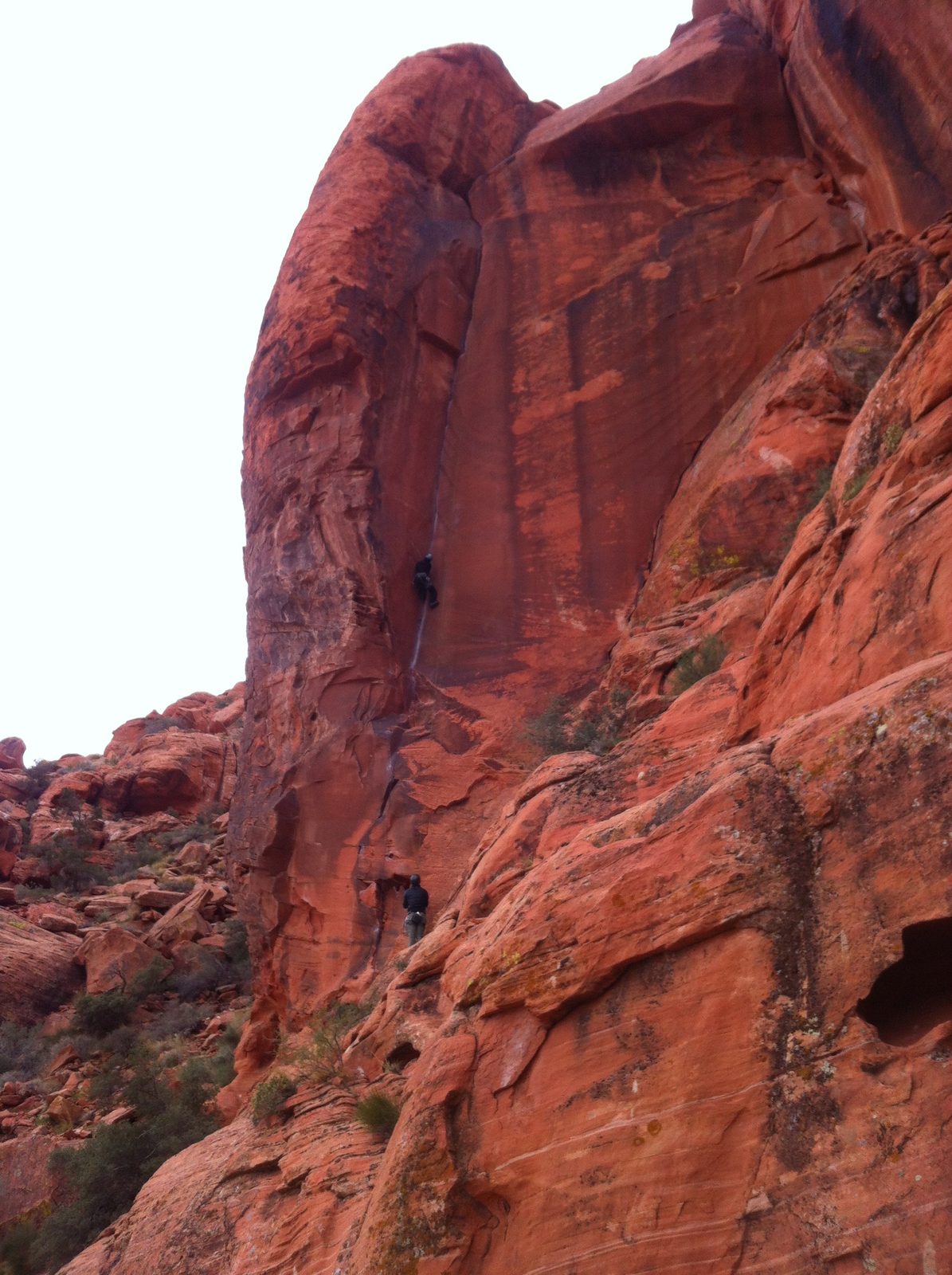 Alex belaying and Monica climbing The Fox (5.10d). The climb follows the dihedral corner up to...