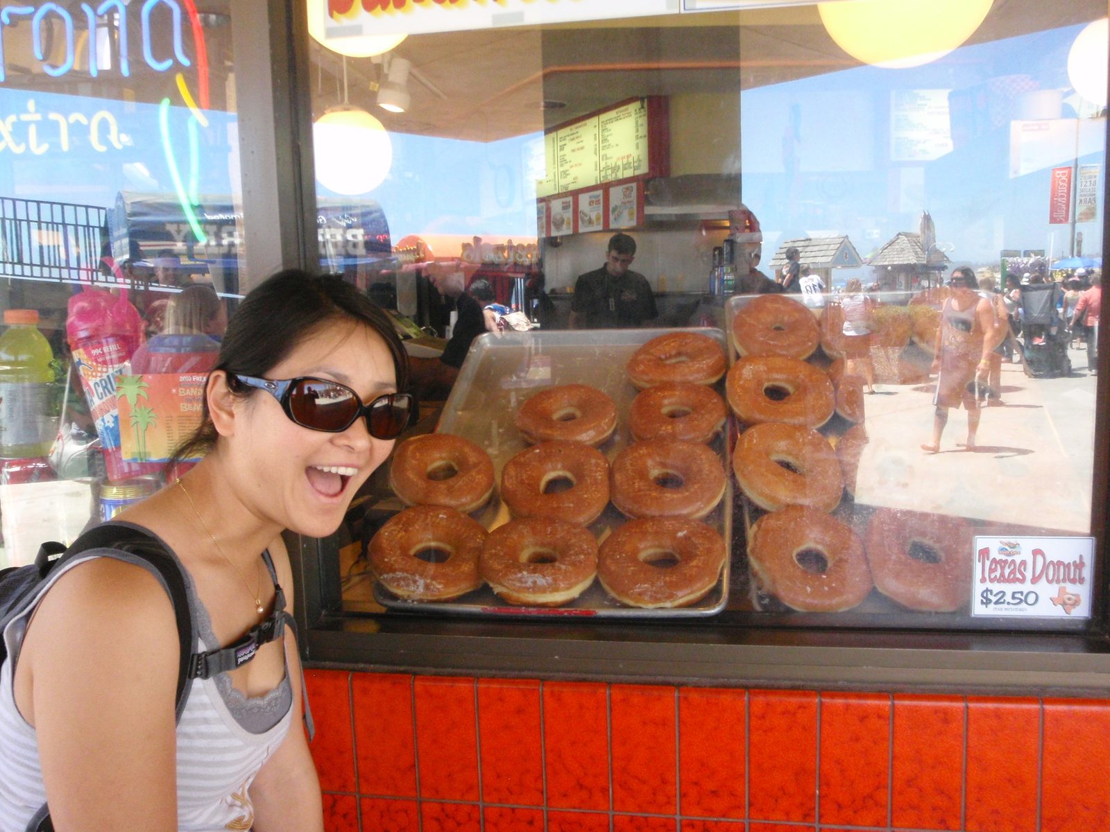 Deep fried doughnuts the size of Monica's head! Look! They call them "Texas Donuts"...