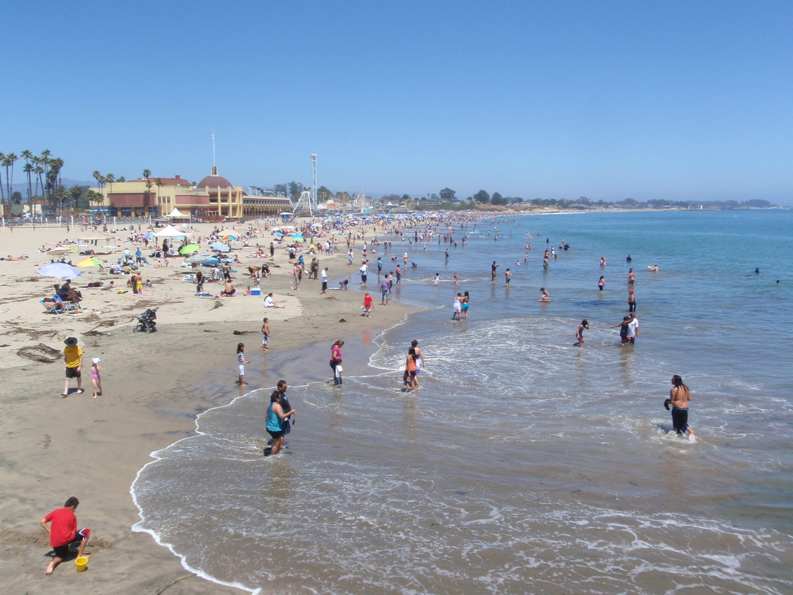 I can't believe so many people are at the beach, especially in the water.