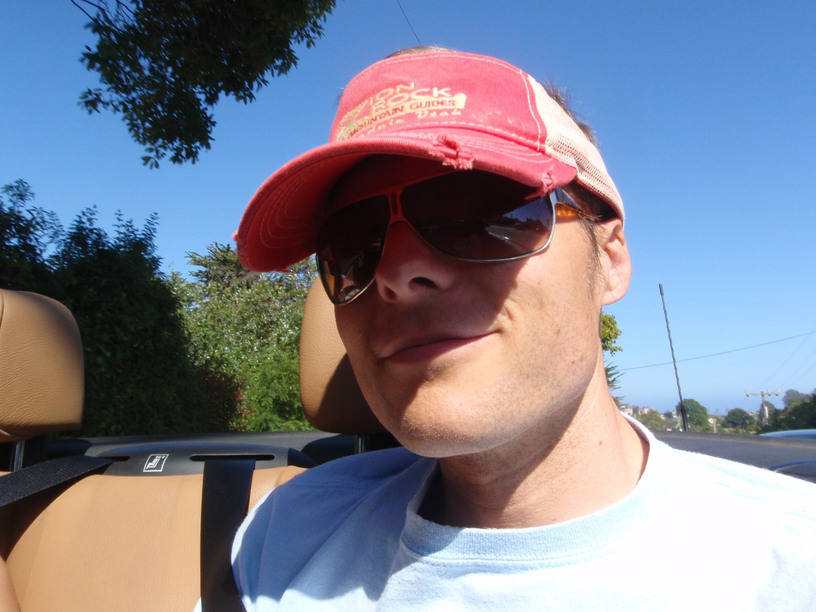 John riding in the convertible.