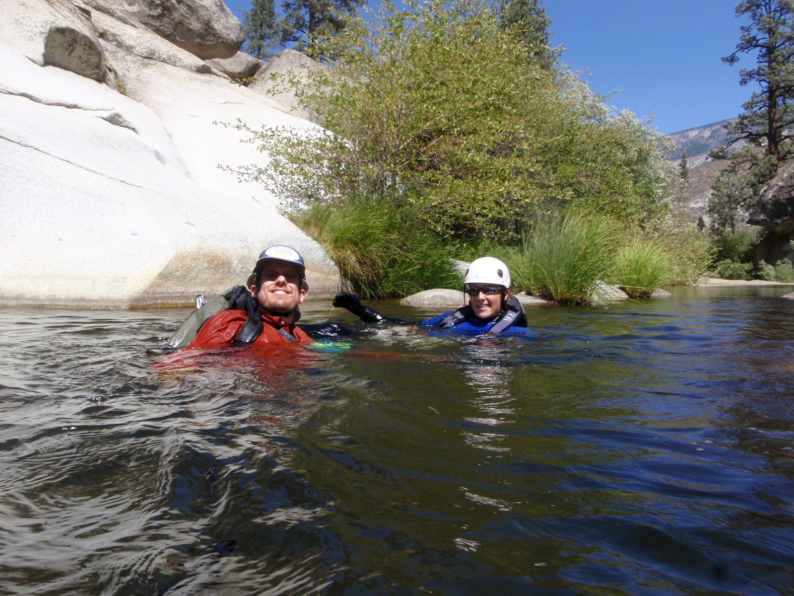 Joel and Catherine paddle down river.