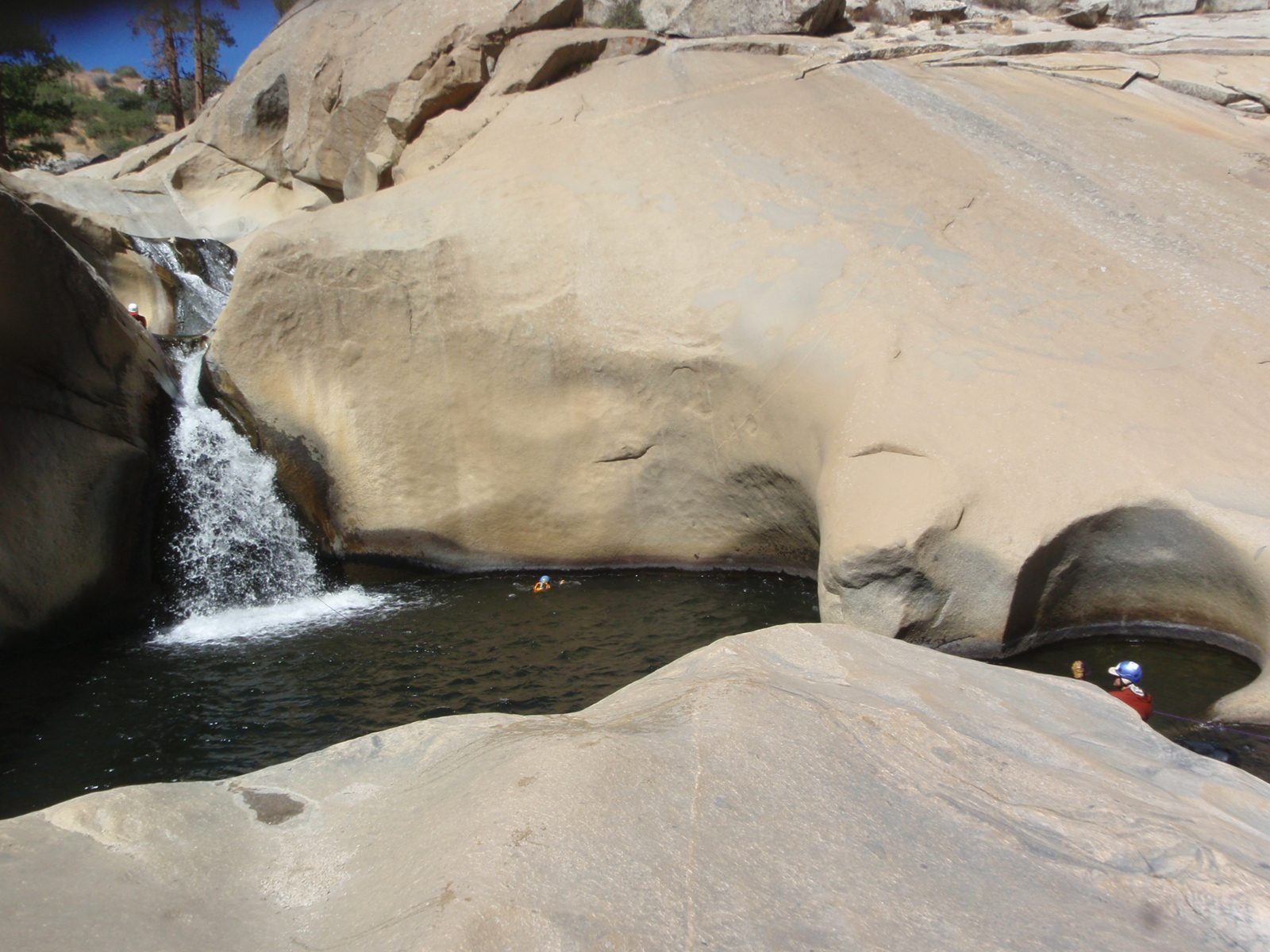 Monica swims across the 5th teacup while Joel sorts the rope.  John is getting ready to rappel.