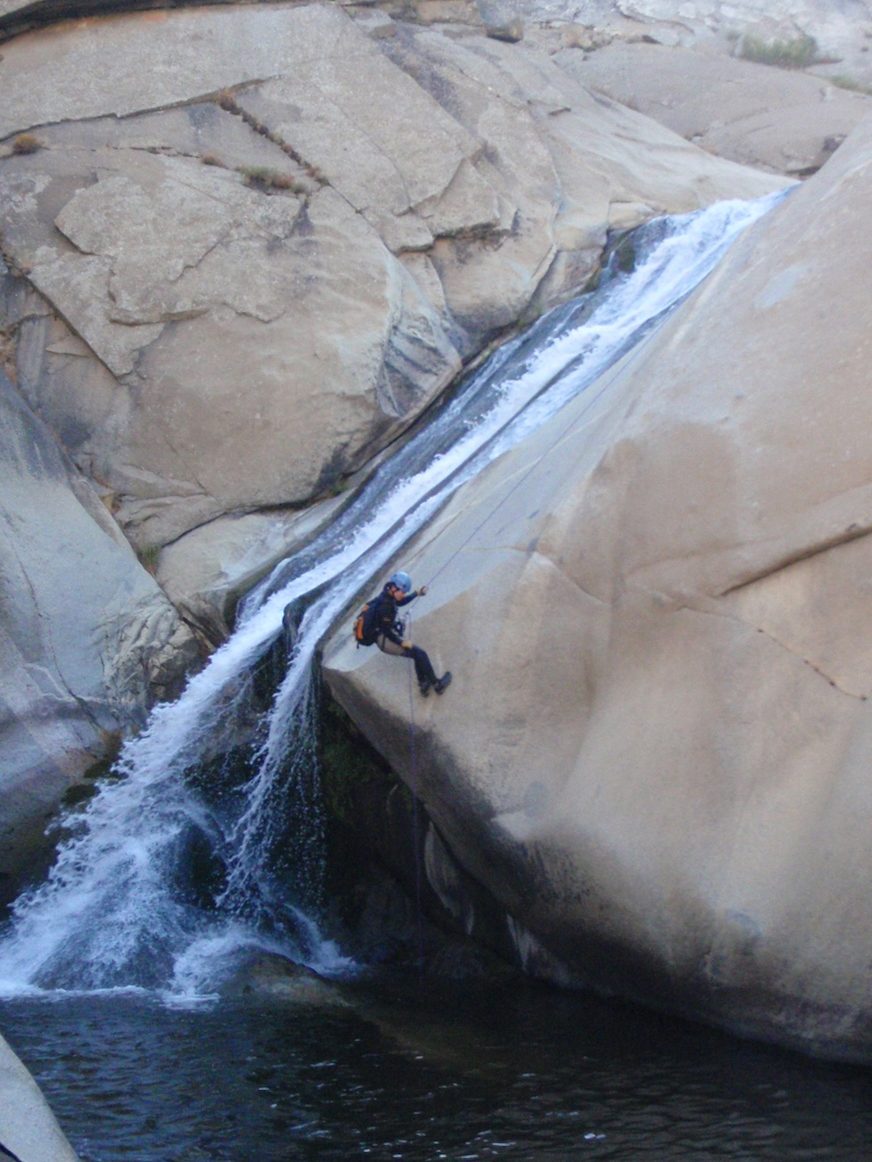 Monica, nearing the end of the 5th rappel which briefly goes free before landing in a pool. ...