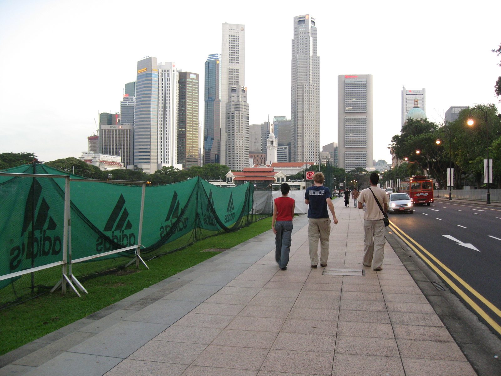Wei, Trevor and Jamie walking back from the Raffles Hotel with Singapore in the background.