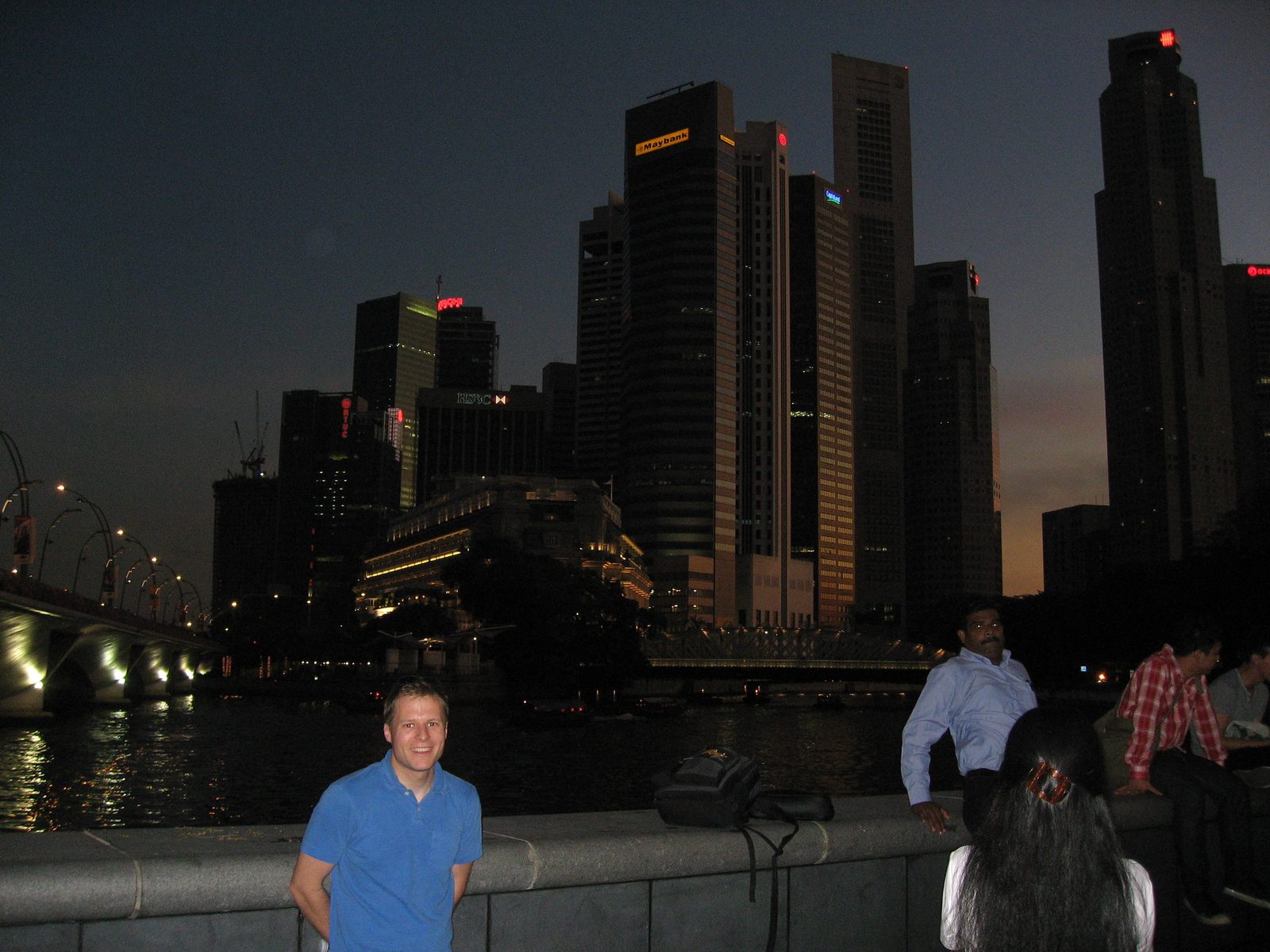 John and the Singapore skyline by night.