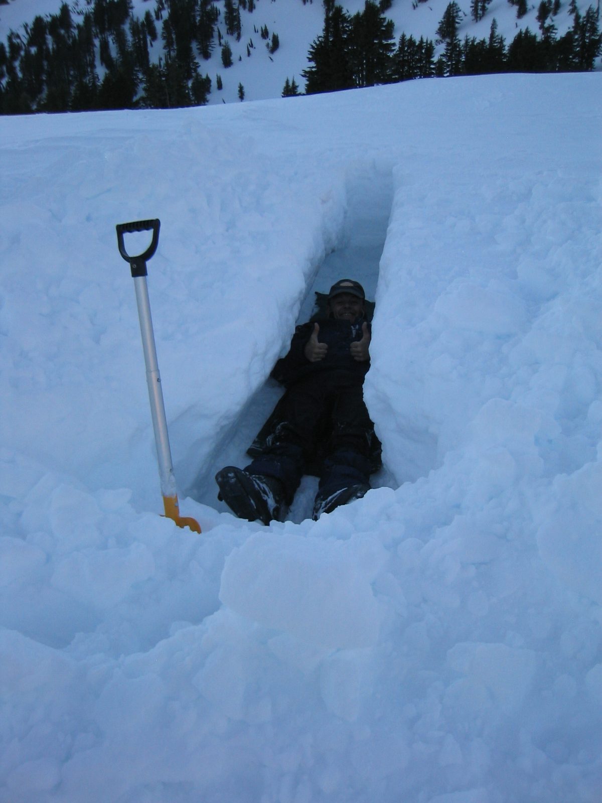 Niels, having just dug his own grave, gives a sign of approval.