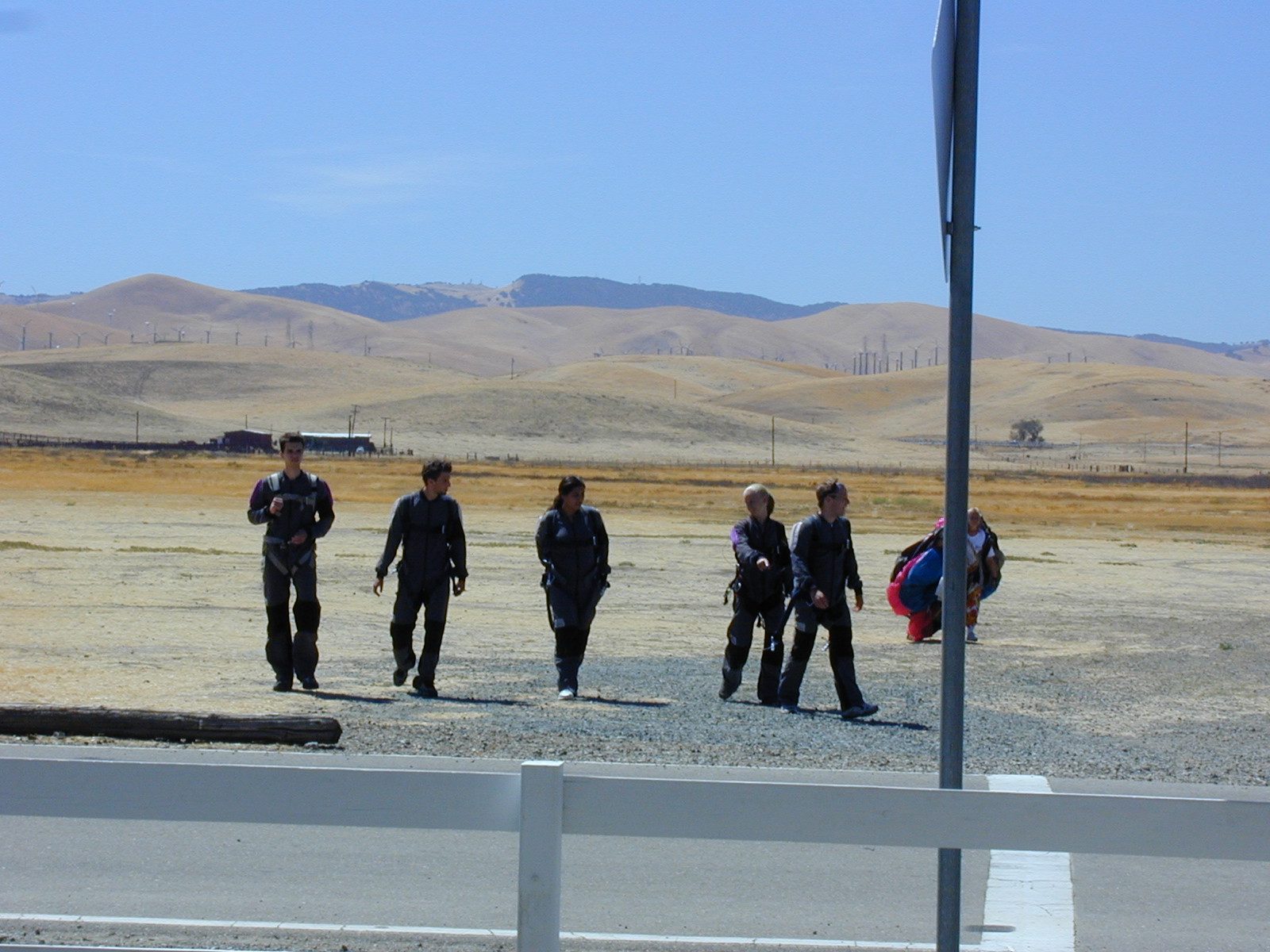 Walking back across the field after landing.