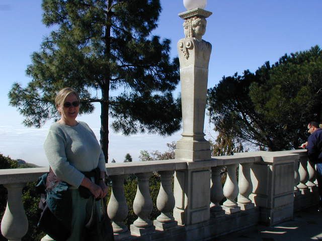 Mom at Hearst Castle.  Note the endless fod and clouds below obscuring the ocean.