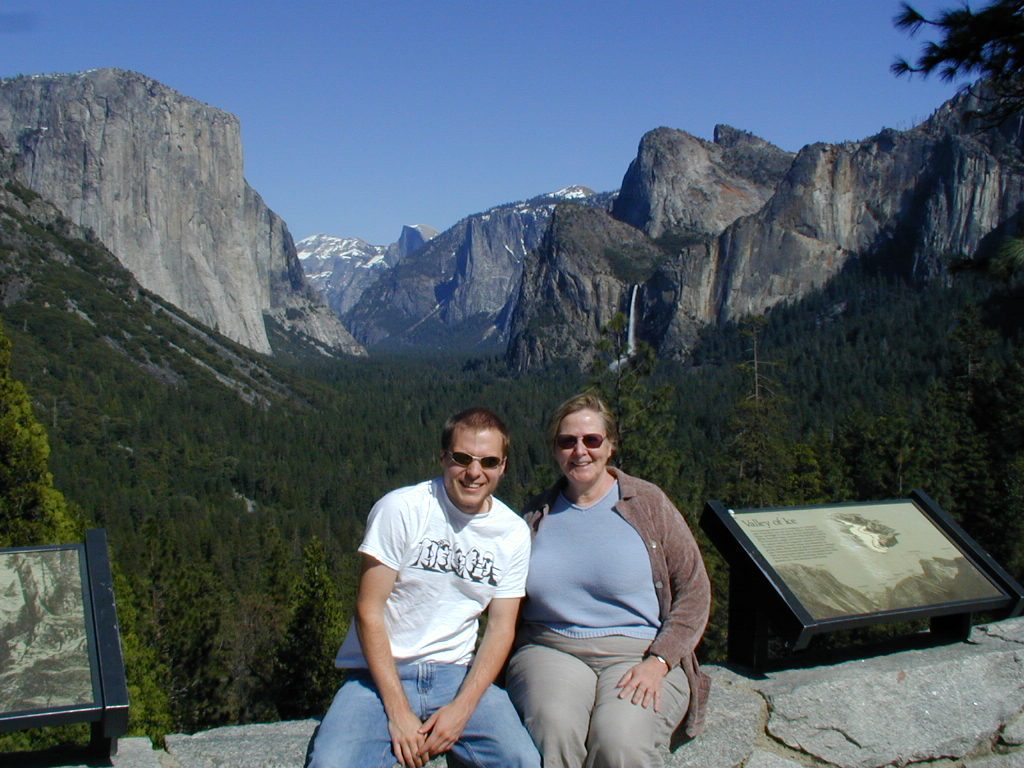 John and Mom at Tunnel View in Yosemite National Park.   Bridalveil Fall visible in the background.