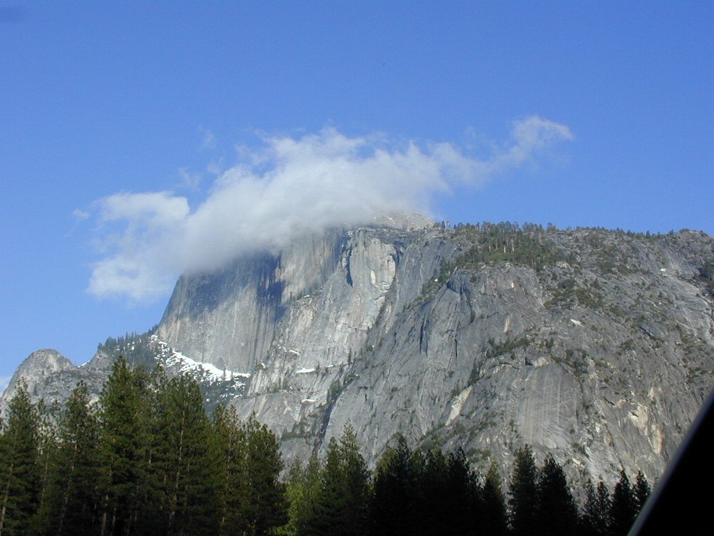 Half Dome wraps itself in a cloud.