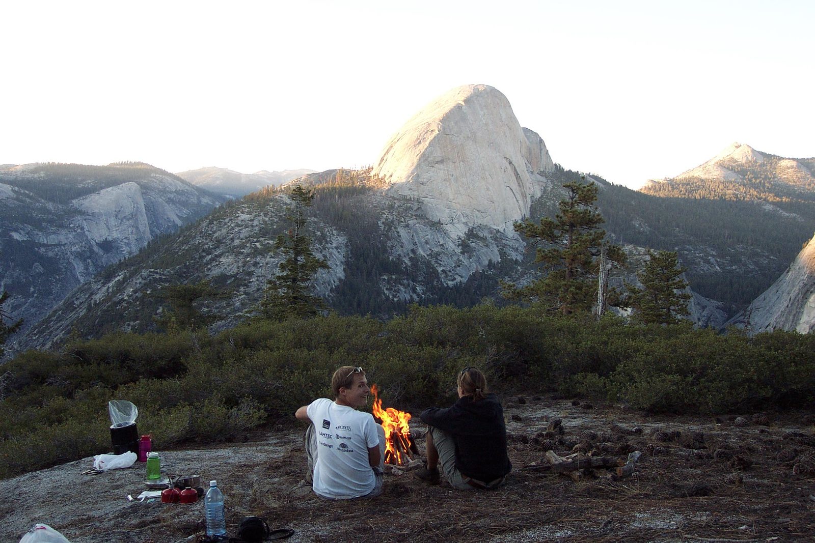 John and Tini warm themselves by the fire.