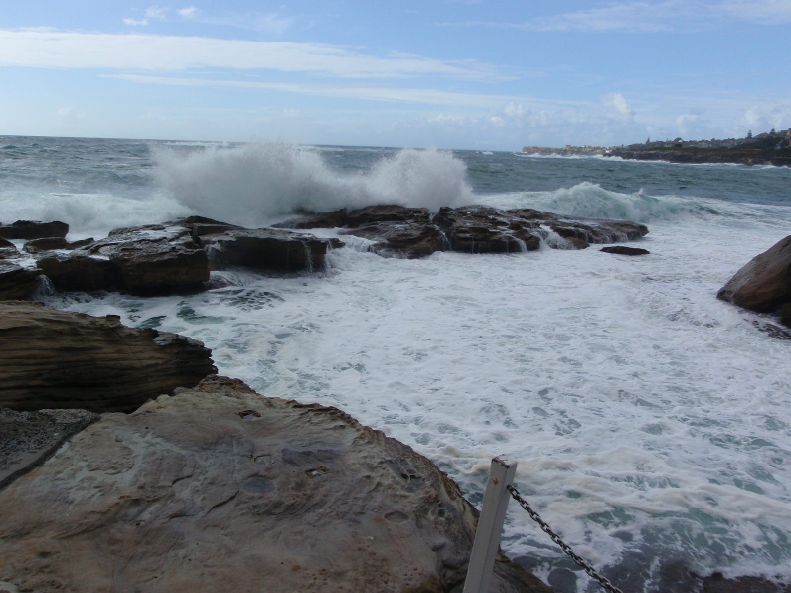 A semi-artificial pool of seawater for bathing offering some protection from the waves and sharks.