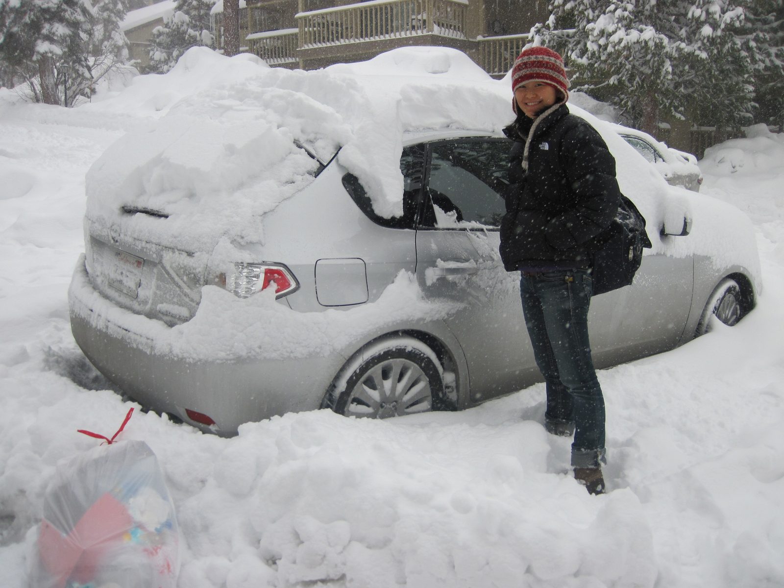 Monica and I start to dig out the car on Sunday, on our first (failed) attempt to leave town.