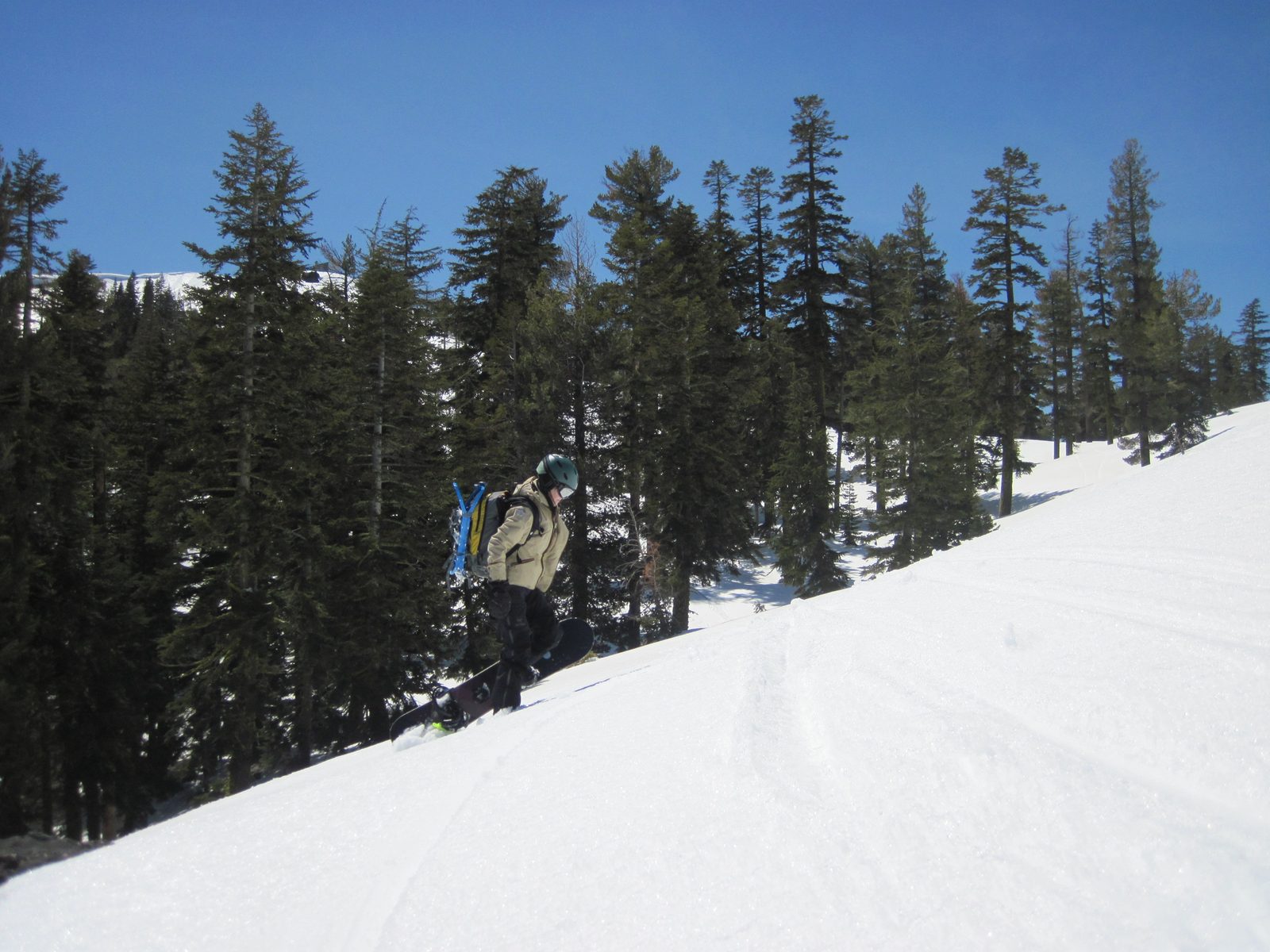 Monica skiing down from Mt. Judah past the southern flank of Donner Peak.