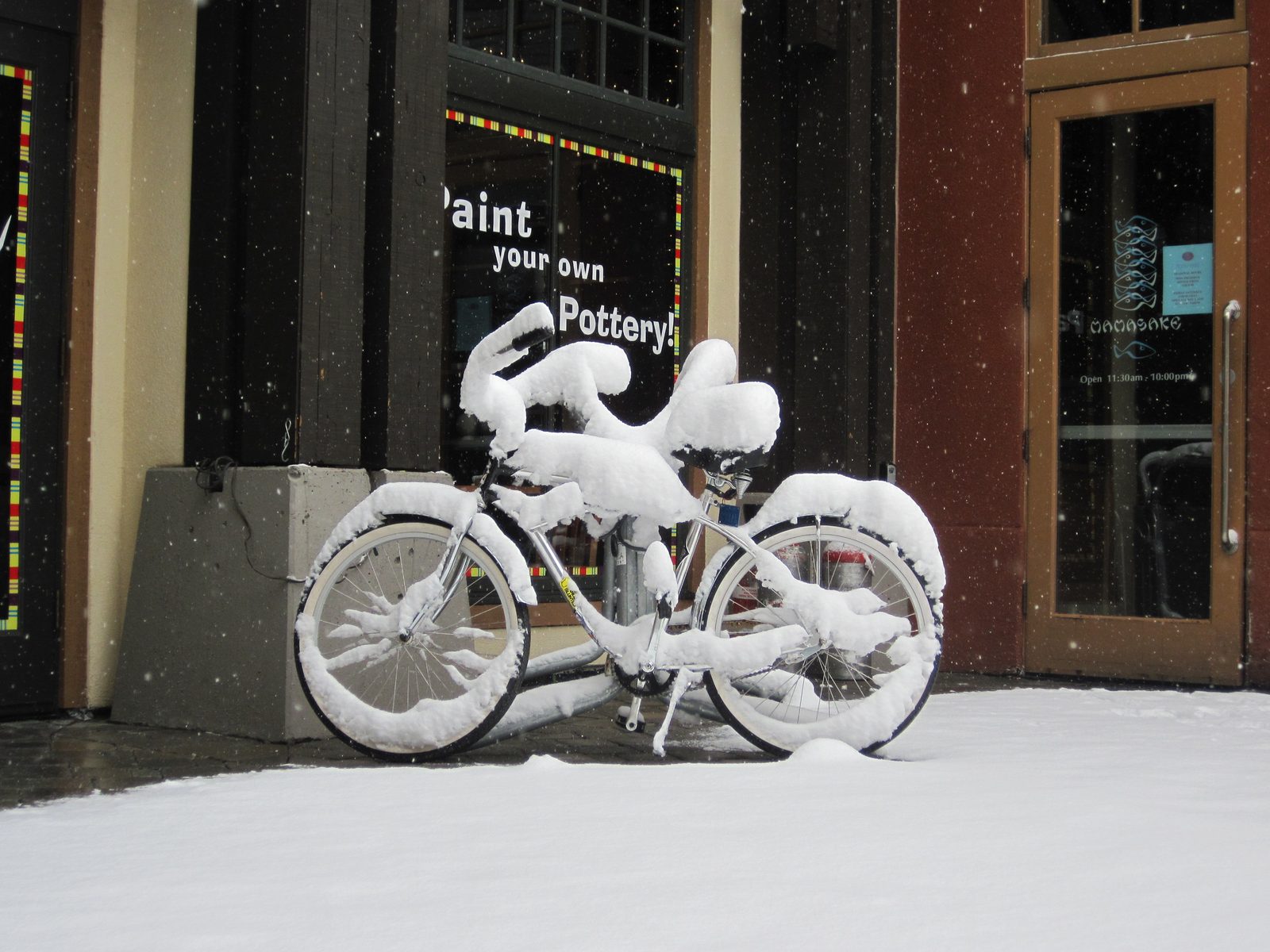 Bicycles with snow in the village at Squaw.