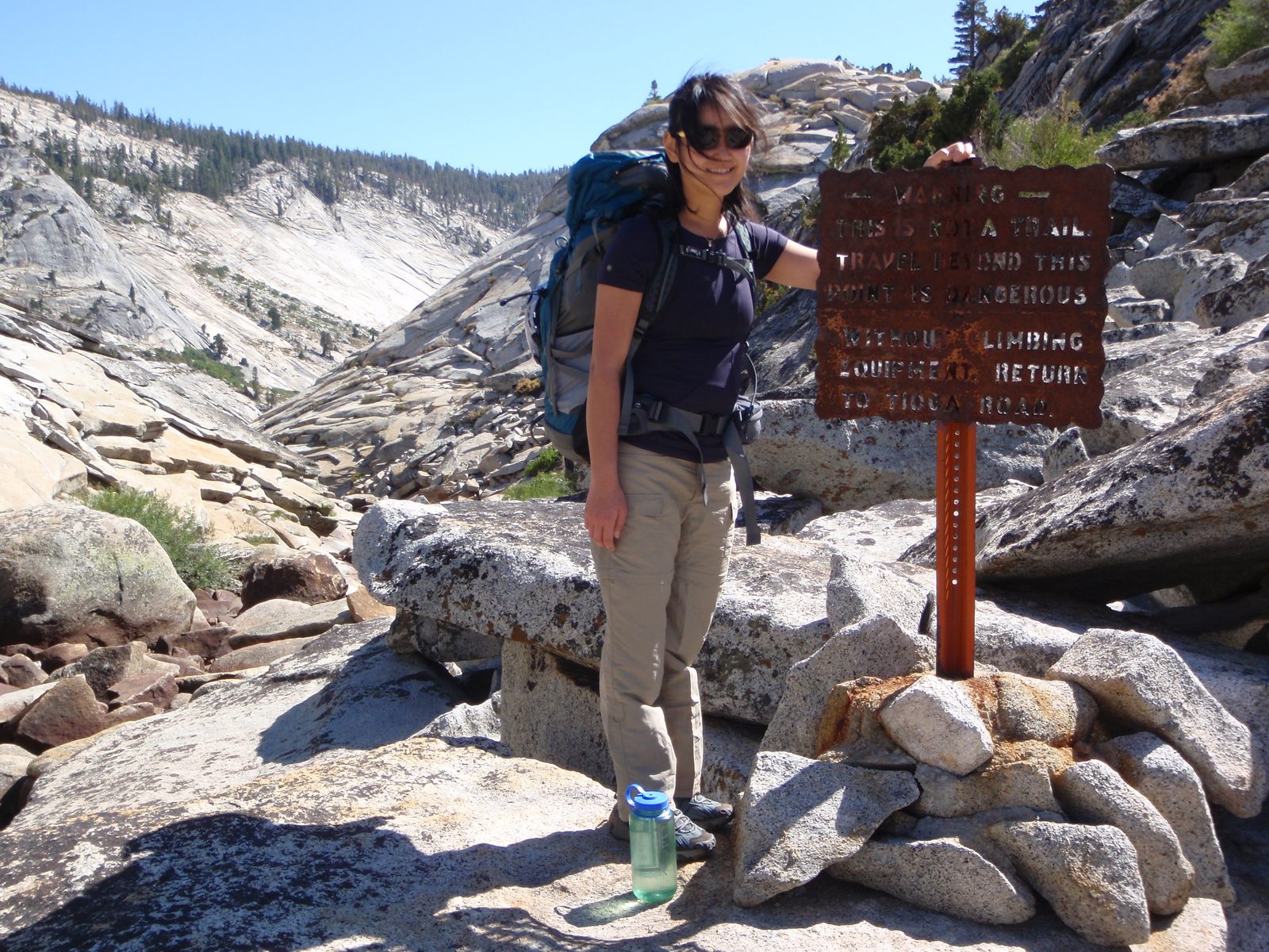 Monica, at the sign telling hikers

"WARNING
This is not a trail
Travel beyond this
point...