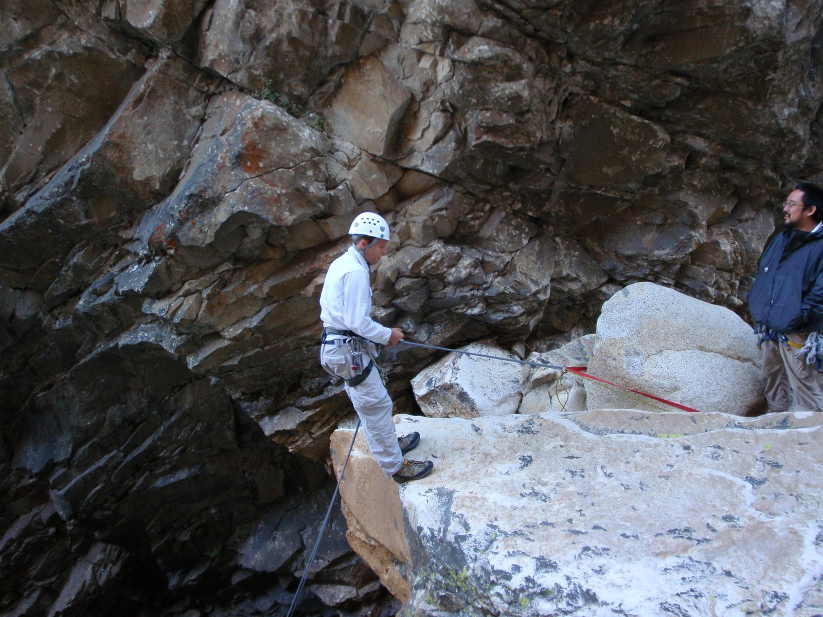 John ready to go through the waterfall (hmm, probably should have put my clothes in the bag I...
