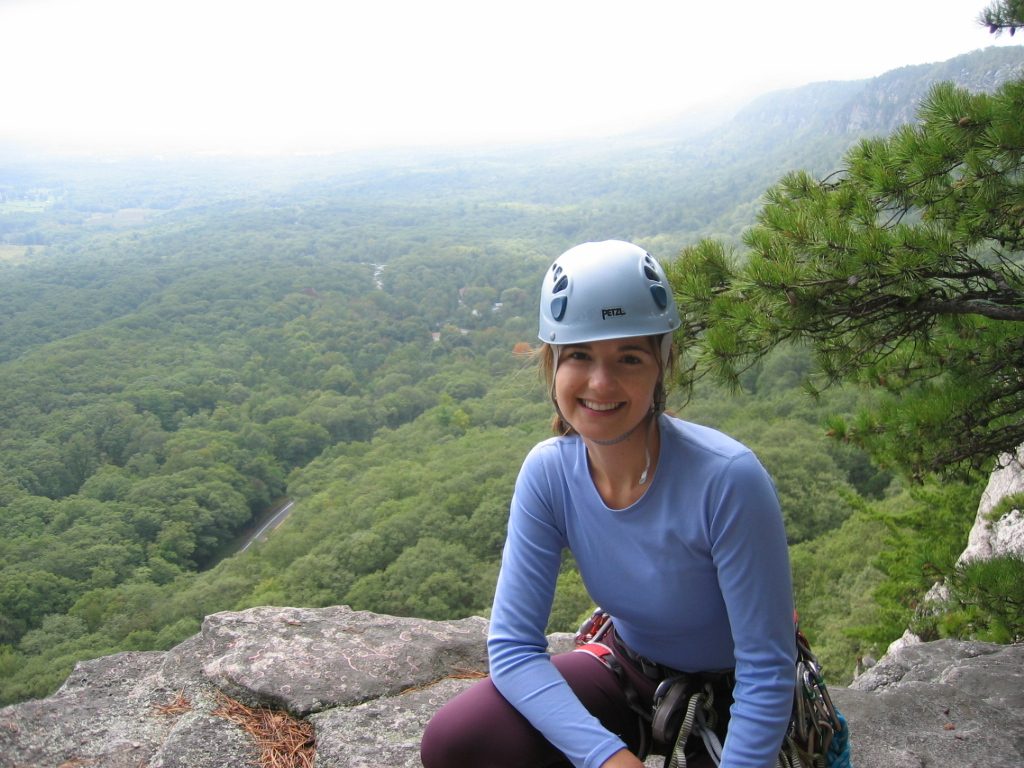 Brenna at the top of Belly Roll (5.3).