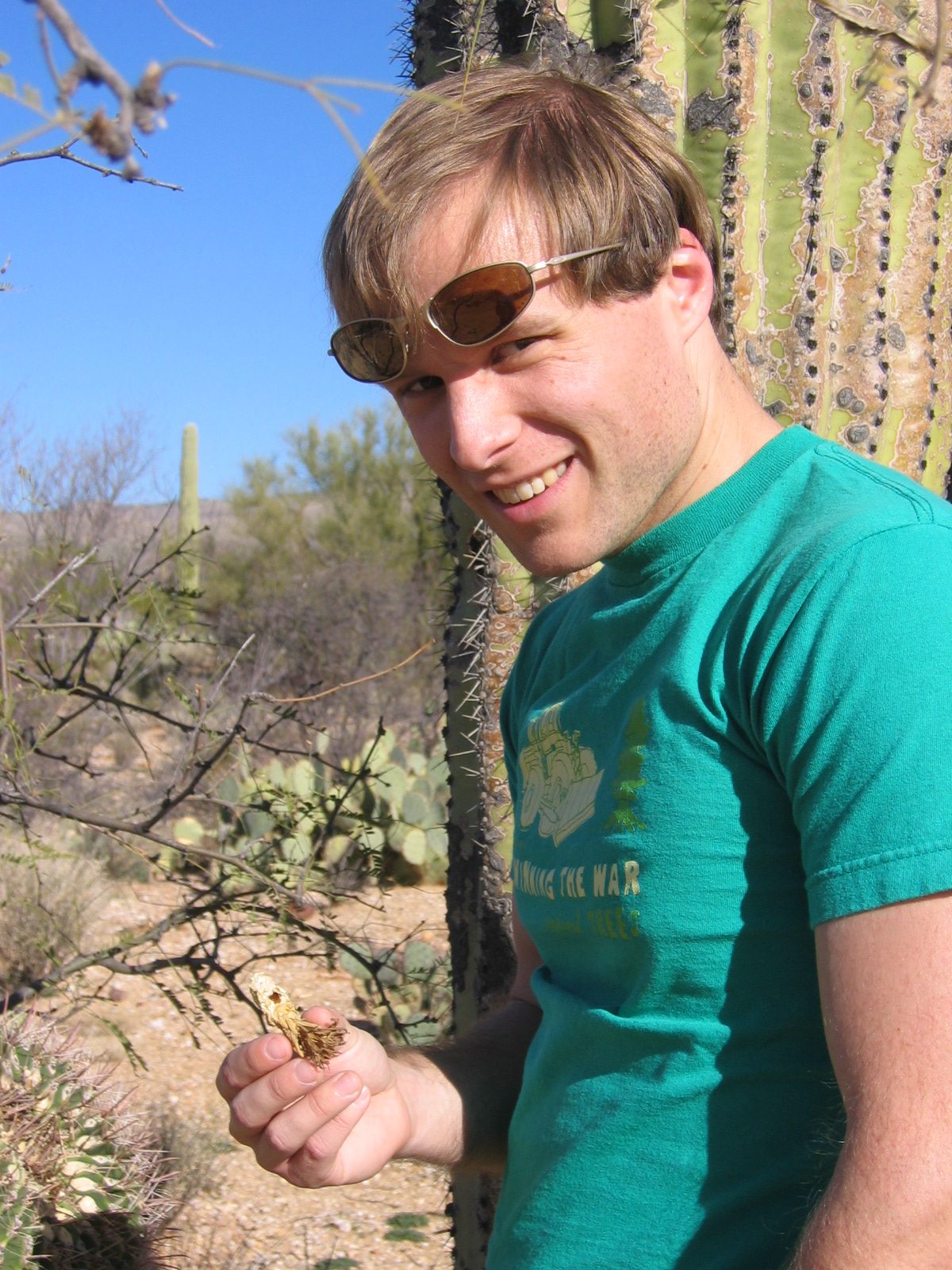 John with the fruit of a saguaro cactus.  (If you look really closely, you can see that some...