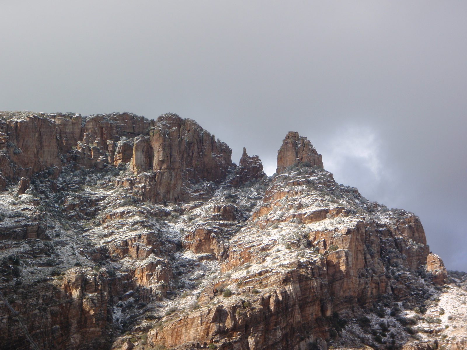 Finger Rock in the snow and sunlight.