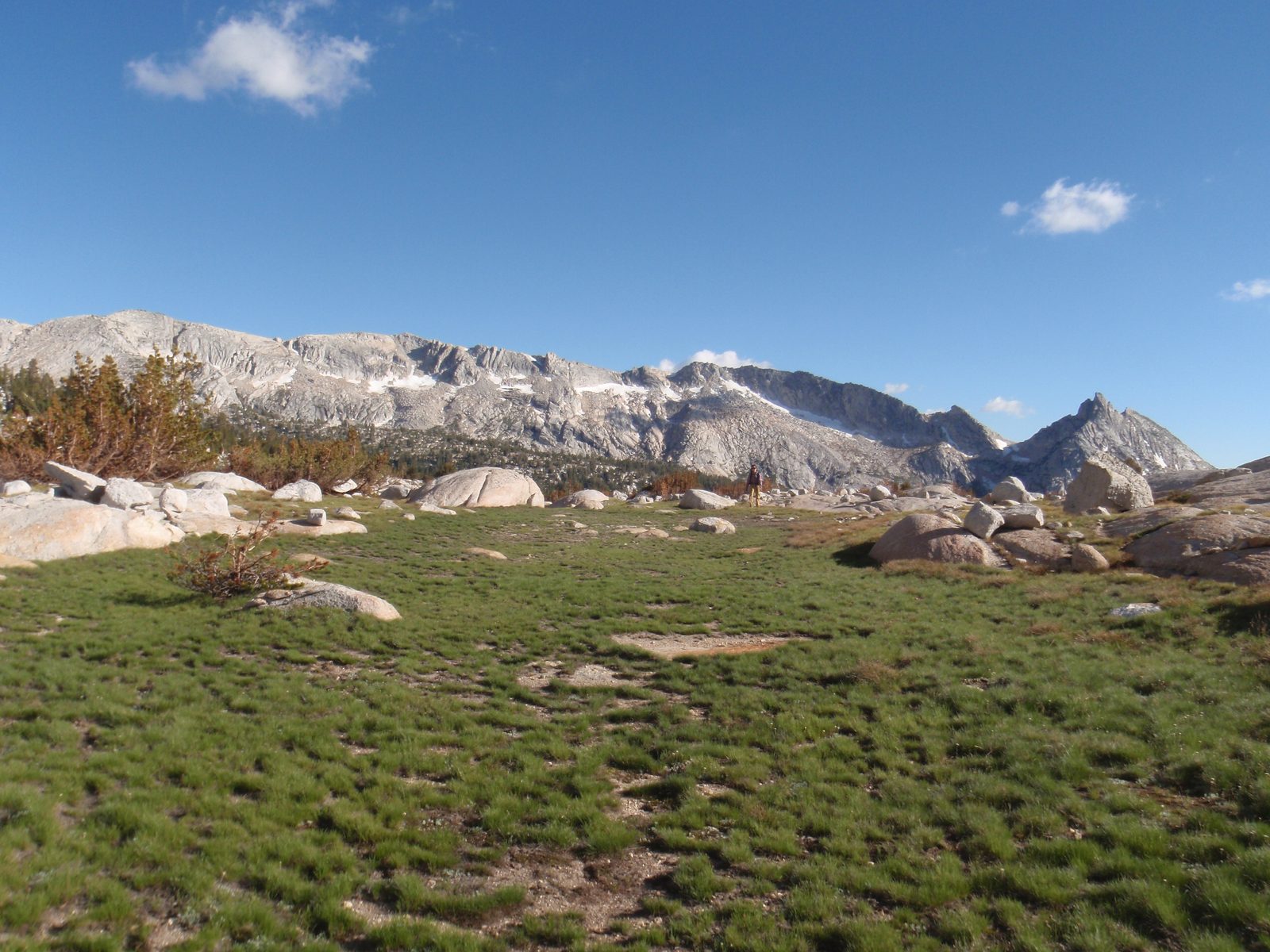 Once out of the woods, we proceeded across easy terrain on a broad shoulder of alpine meadow and boulder.
