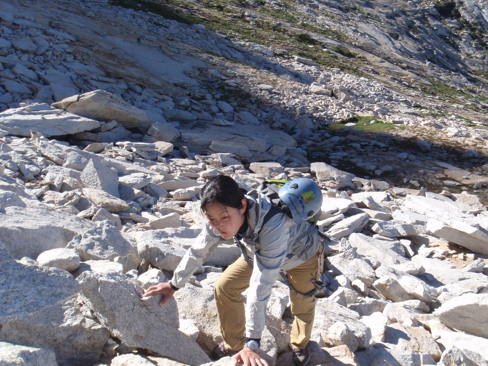 Climbing up the talus at the base of the climb.