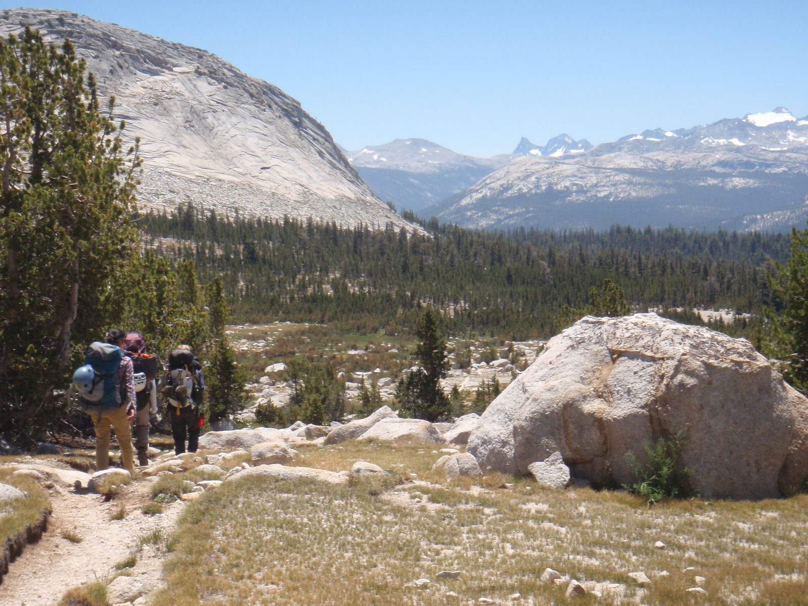 Hiking along. Clark Range barely visible (dark colored jagged mountains).