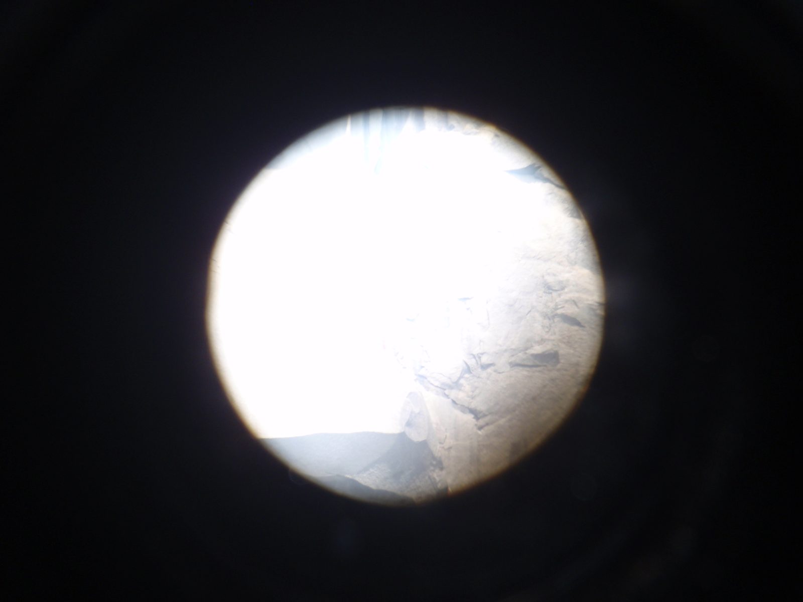 An attempt to take a photo through a telescope of a team of Korean climbers on The Zodiac, a...