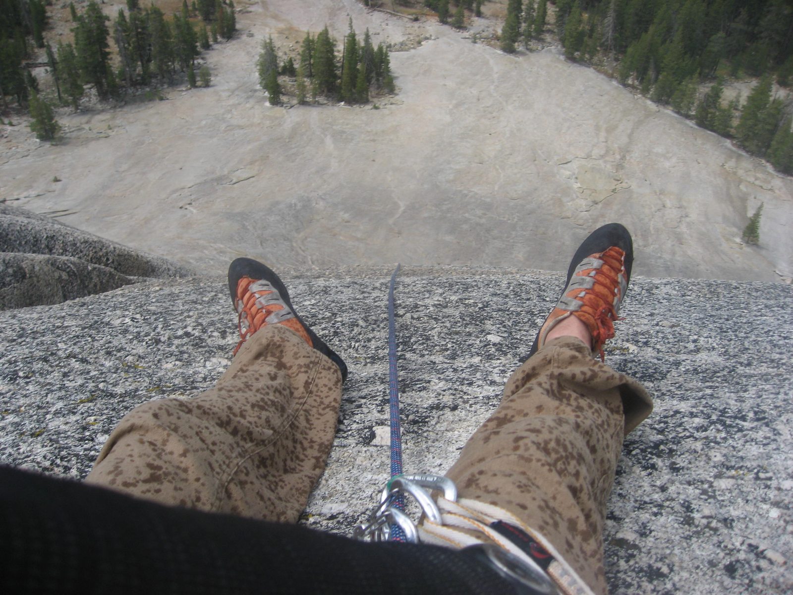 At the final belay ledge (Monica now out of sight). And of course, like clockwork, here comes the rain!