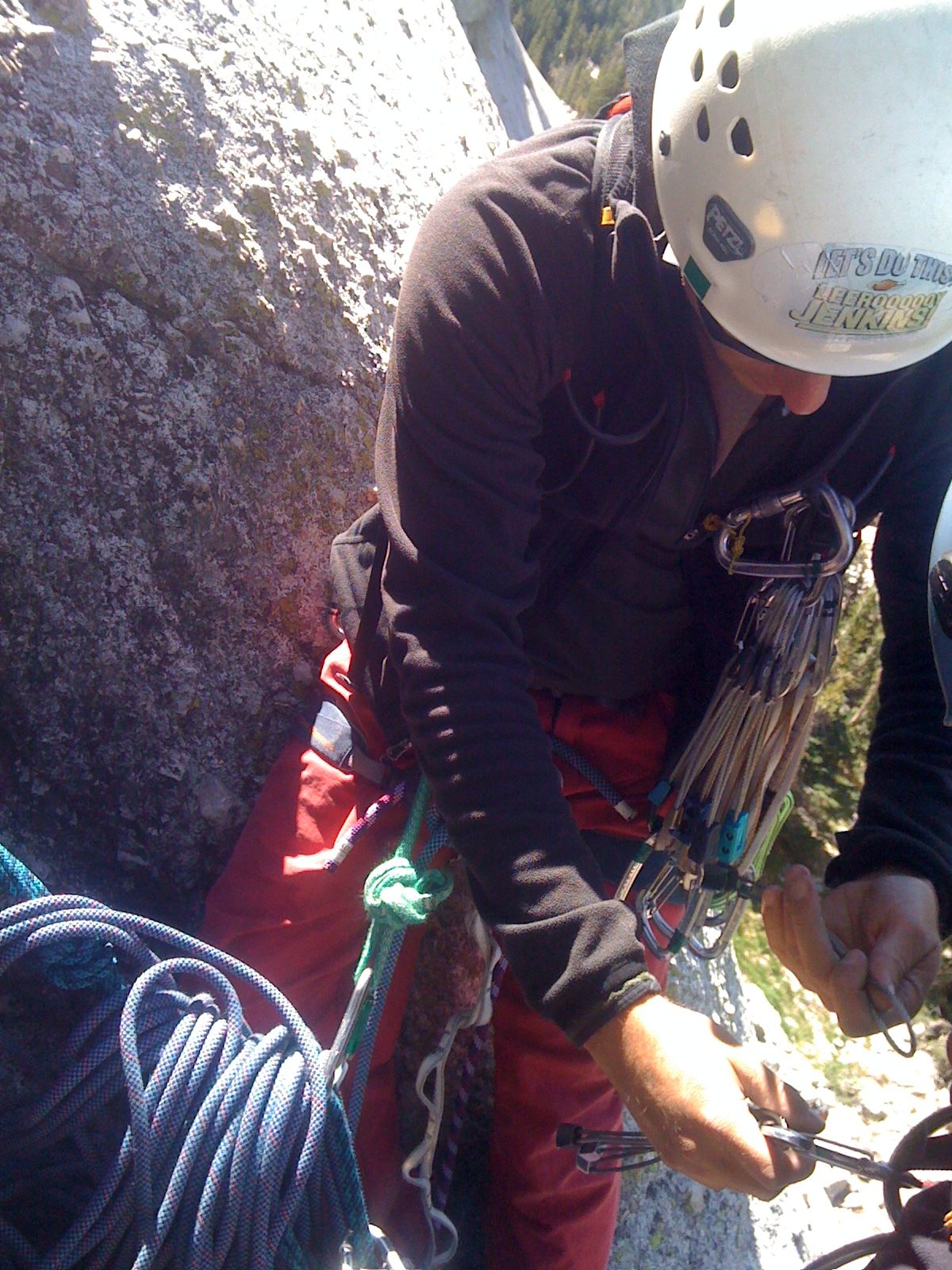 John and Monica sorting gear at the top of the first pitch of Holdless Horror (5.6).