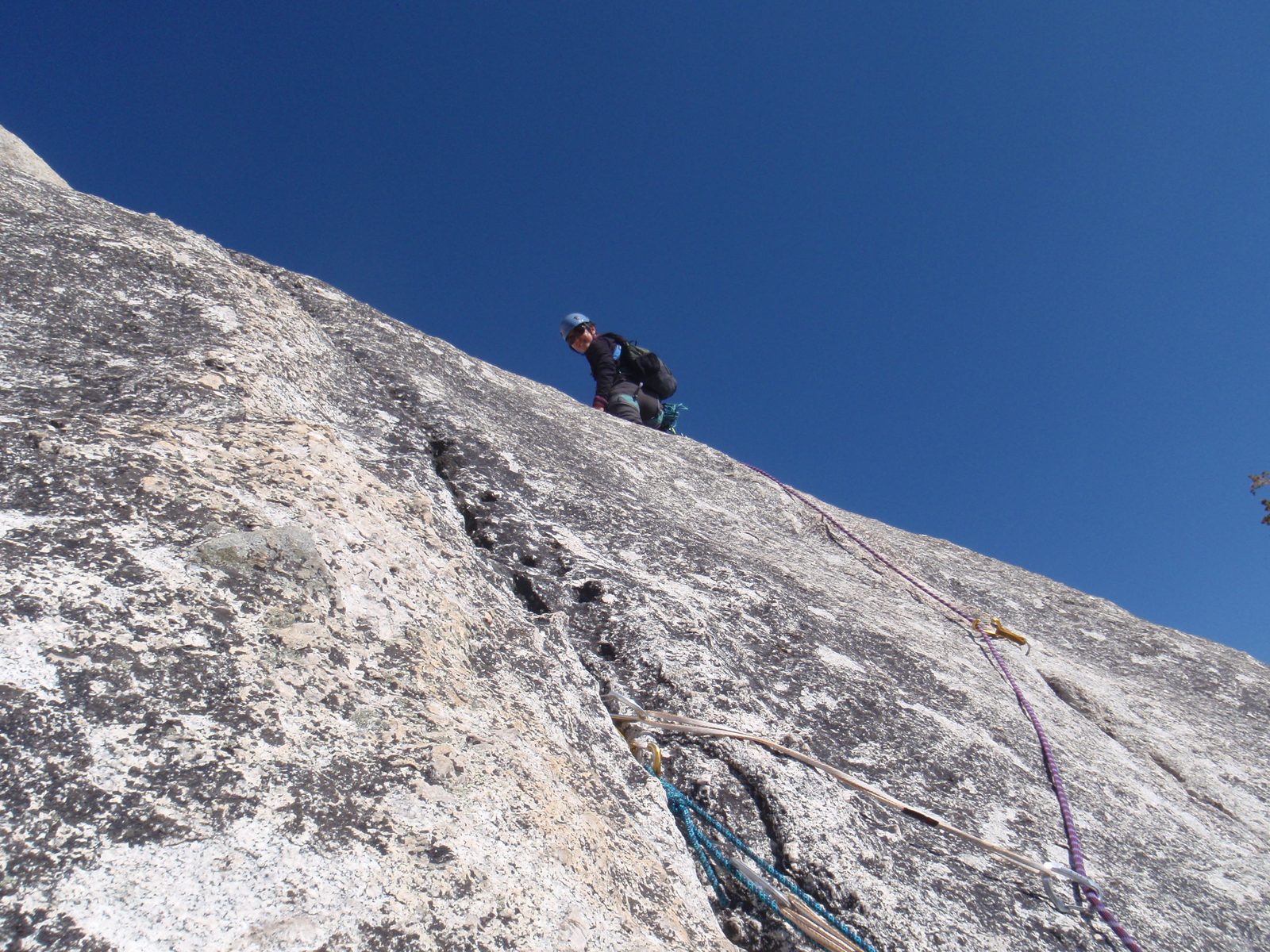 Monica at a good resting spot on lead, fourth pitch of West Crack (5.9).
