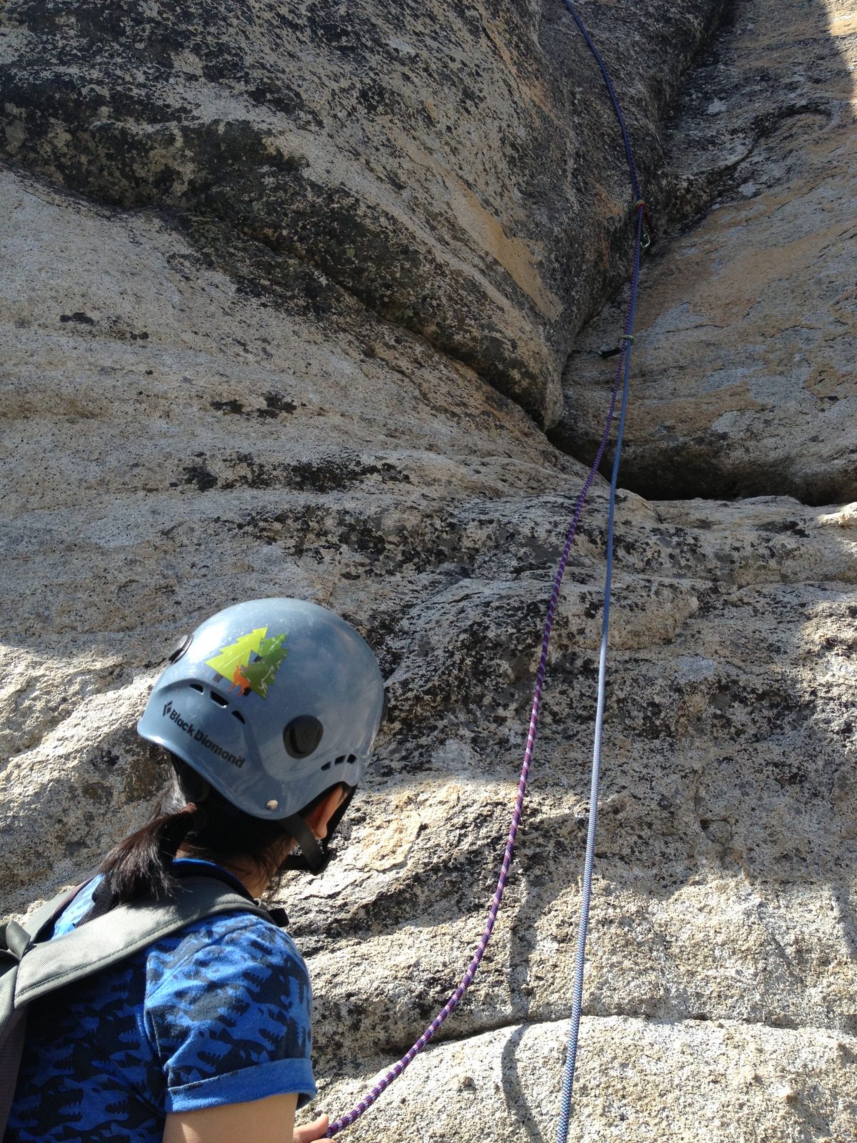 Monica belaying while John climbs the 5.10b crux pitch 3.