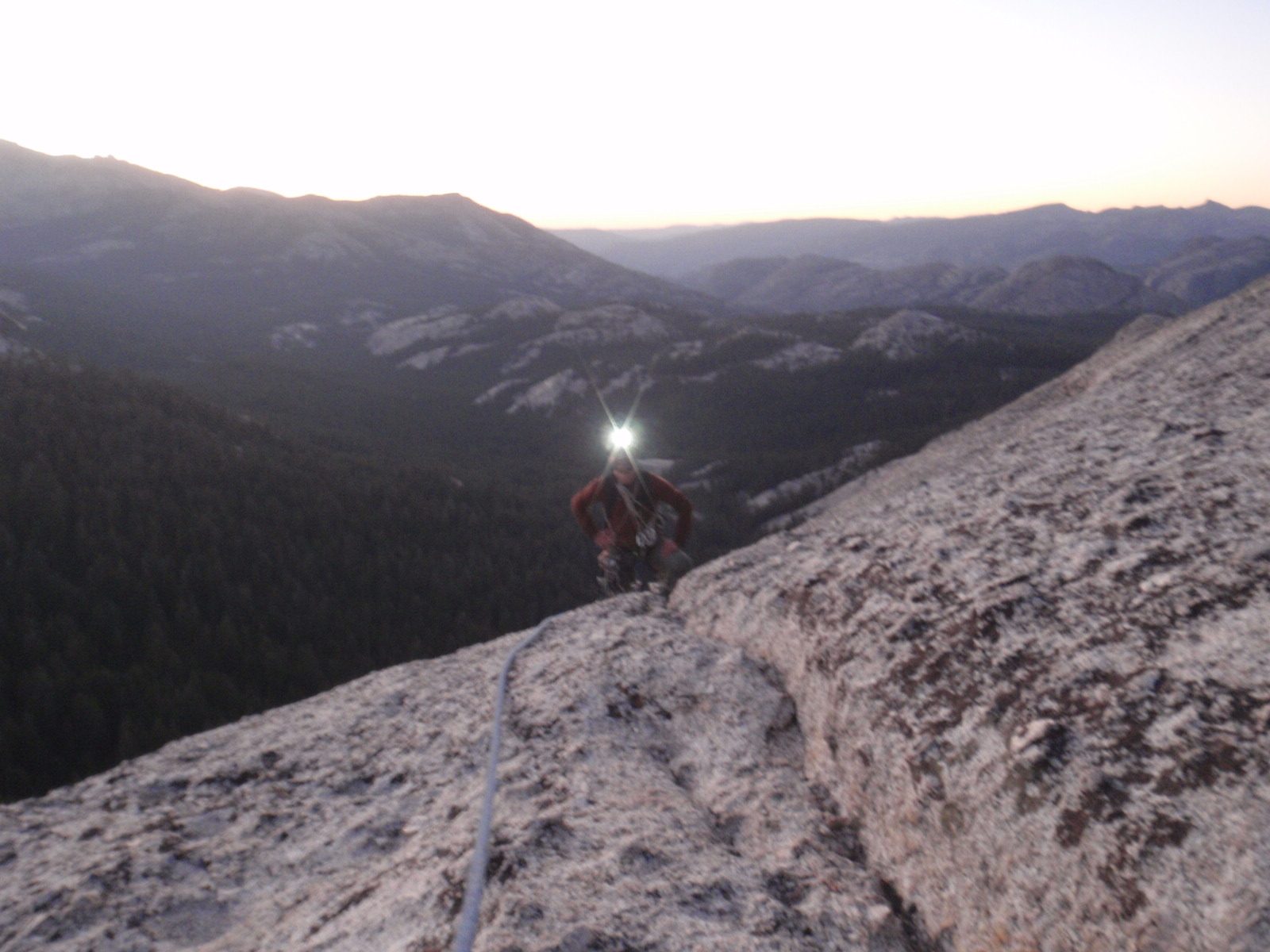 At the top of the climb, just after sunset. Headlamp on for good measure.