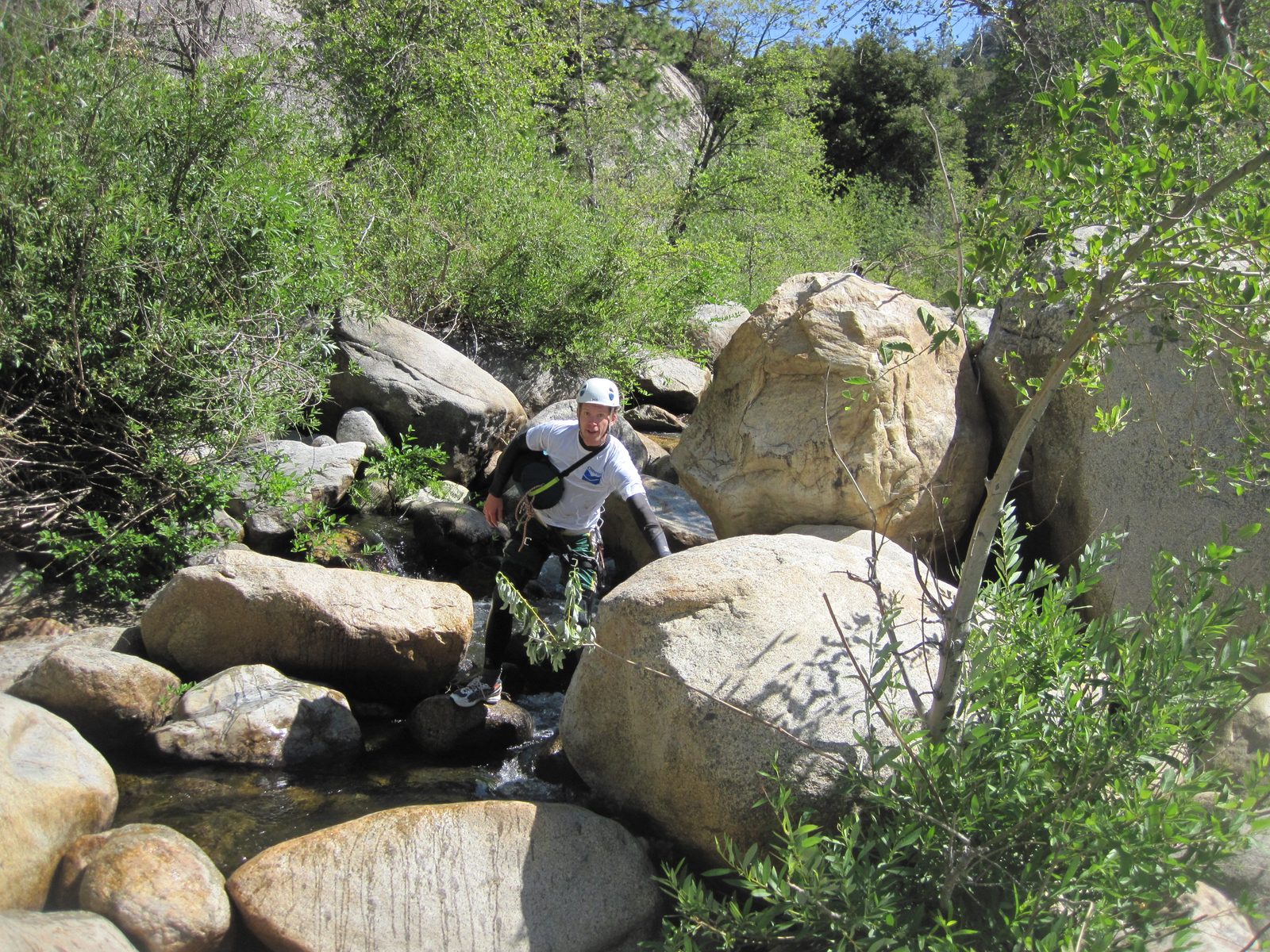 Ben hopping over some rocks.
